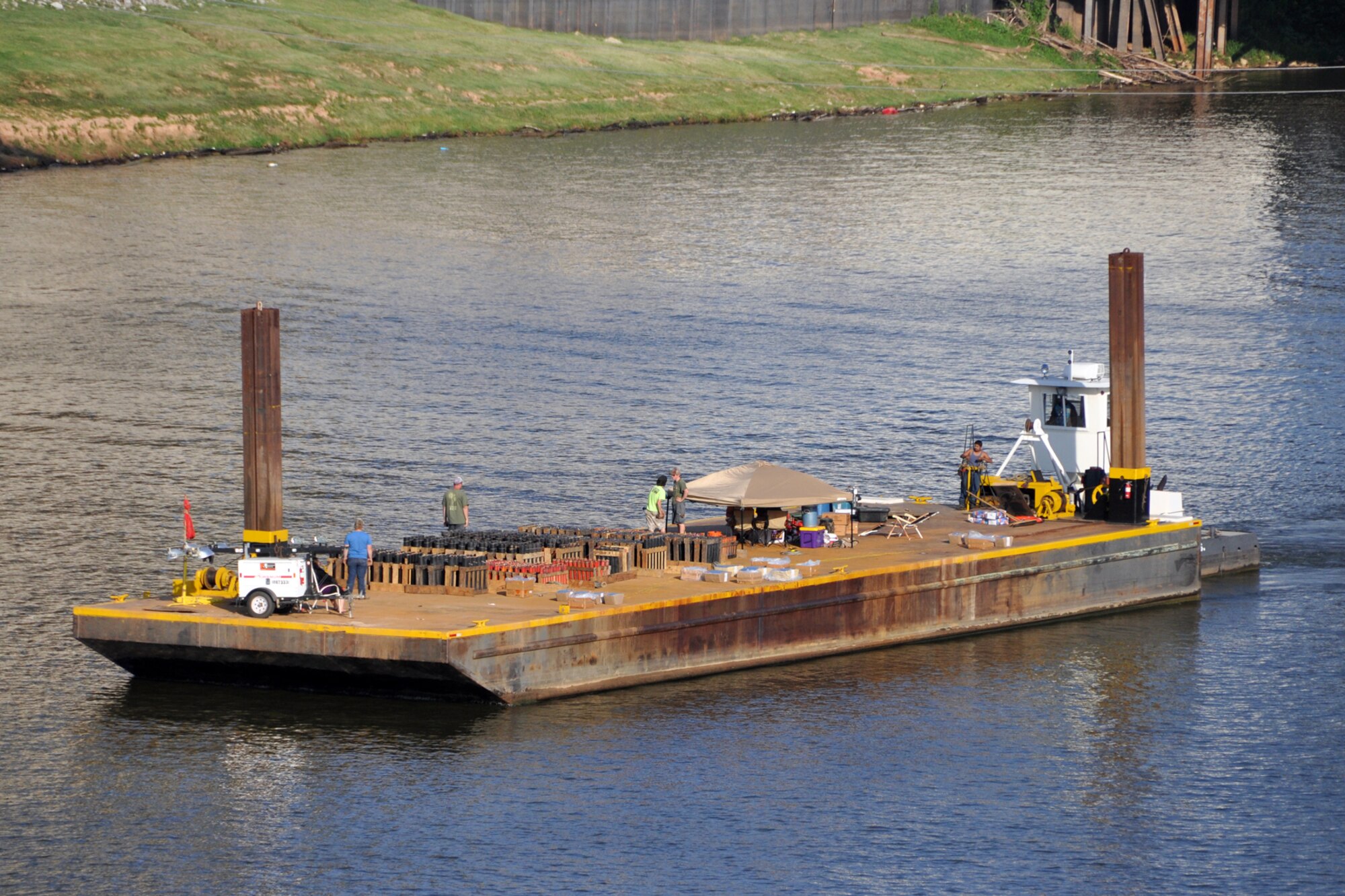 The fireworks barge for the Independence Day celebration makes its way up the Red River in Shreveport, La., July 4, 2012. The celebration at Riverview Park featured many types of food and beverage vendors, music from Collin Raye, and a flyover by a B-52 Stratofortress from the 307th Bomb Wing at Barksdale Air Force Base. La. (U.S. Air Force photo by Master Sgt. Jeff Walston)