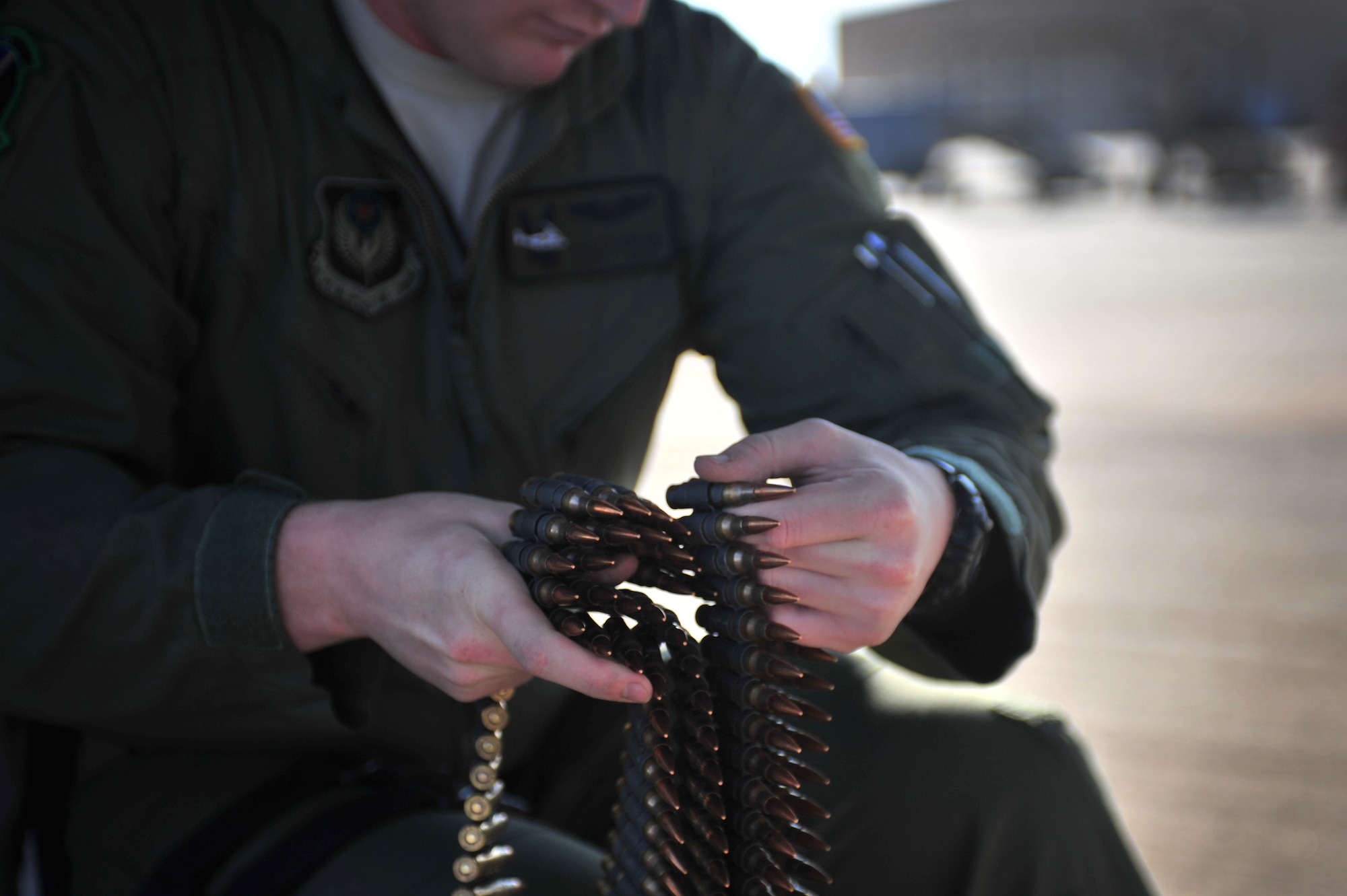 U.S. Air Force Staff Sgt. Casey Spang, 20th Special Operations Squadron flight engineer, inspects ammunition prior to takeoff on the flightline at Cannon Air Force Base, N.M., July 5, 2012. The 20 SOS conducted a routine training flight over Melrose Air Force Range, N.M. (U.S. Air Force photo by Airman 1st Class Alexxis Pons Abascal) 