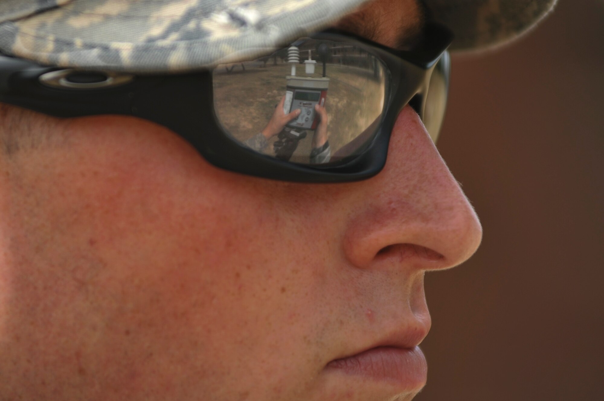 Airman 1st Class Mathew Footit, a 19th Aerospace Medical Squadron bio and enivromental technician, checks the reading on a wet bulb globe temperature monitor  monitor July 3, 2012, at Little Rock Air Force Base, Ark. The readings of the monitor are recorded every two hours, and every hour if the temperatures exceeds 85 degrees. 
(U.S. Air Force photo by Airman 1st Class Rusty Frank)