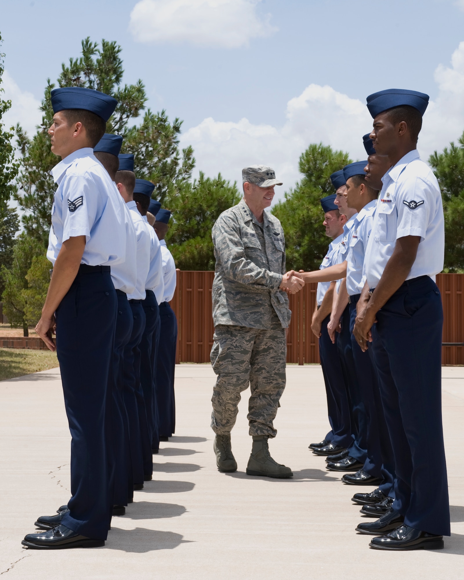 U.S. Air Force Lt. Gen. Robin Rand, 12th Air Force commander, visits with Dyess Honor Guard Airmen July 2, 2012, at Dyess Air Force Base, Texas. During his visit, Rand expressed his gratitude to all Dyess Airmen and their families for their outstanding support of global missions and operations. (U.S. Air Force photo by Staff Sgt. Richard P. Ebensberger/ Released)