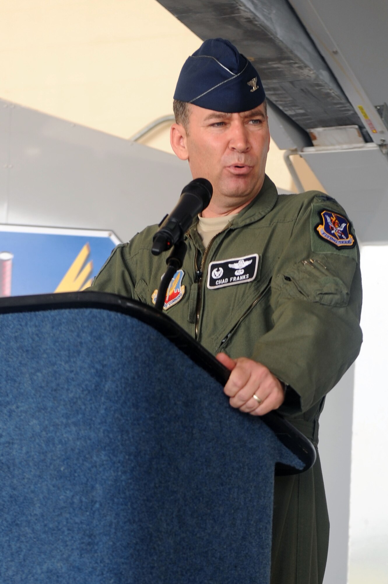 U.S. Air Force Col. Chad Franks, 347th Rescue Group outgoing commander, speaks to attendees of the change of command ceremony at Moody Air Force Base, Ga., July 5, 2012. Franks leaves the 347th RQG to be the U.S. Air Forces Central chief of staff. (U.S. Air Force photo by Staff Sgt. Ciara Wymbs/Released) 