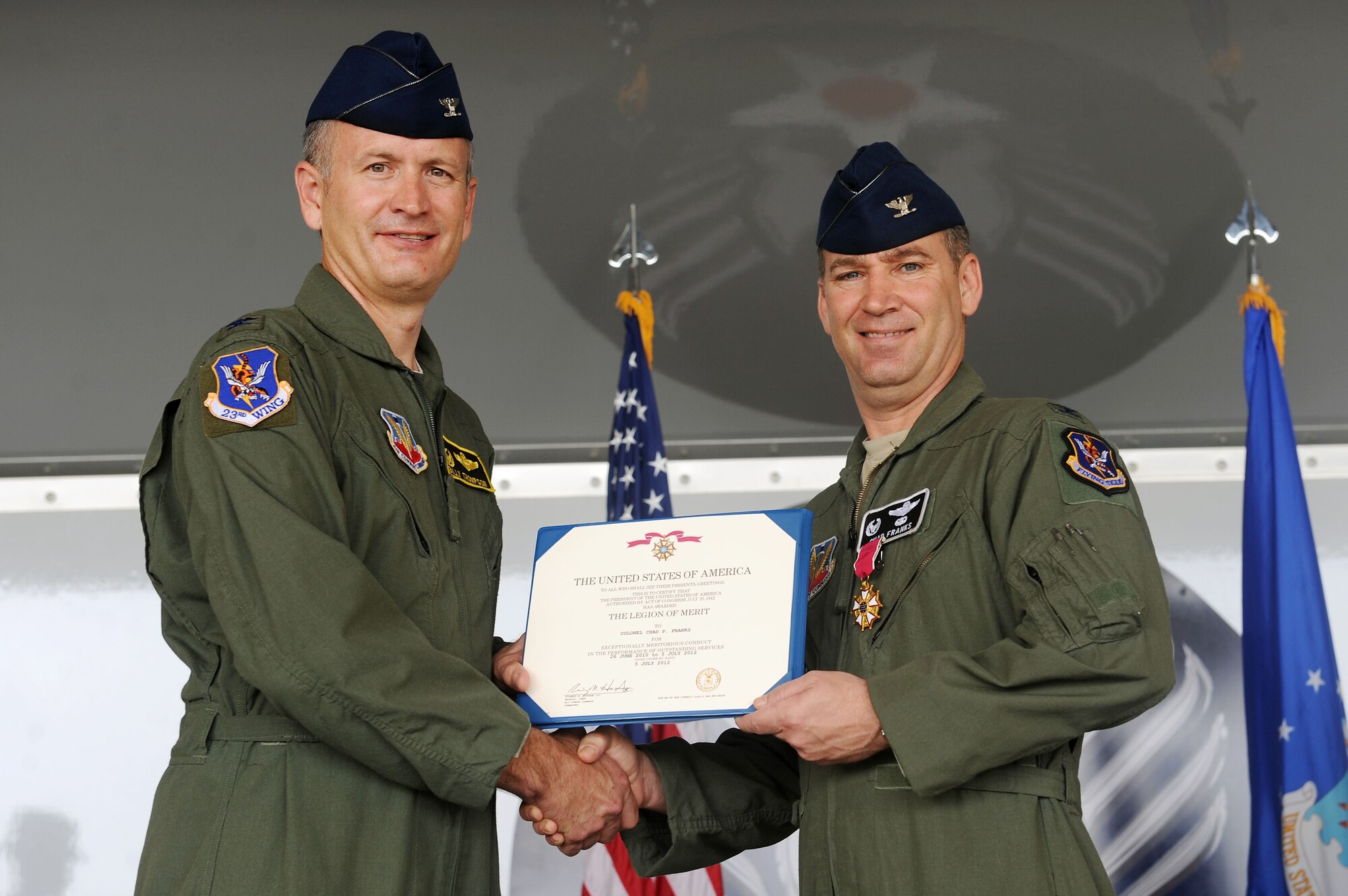U.S. Air Force Col. Billy Thompson, 23d Wing commander, presents Col. Chad Franks, 347th Rescue Group commander, the Legion of Merit at Moody Air Force Base, Ga., July 5, 2012.  Franks received the award for his work and leadership with the 347th RQG during the past two years. (U.S. Air Force photo by Staff Sgt. Ciara Wymbs/Released)