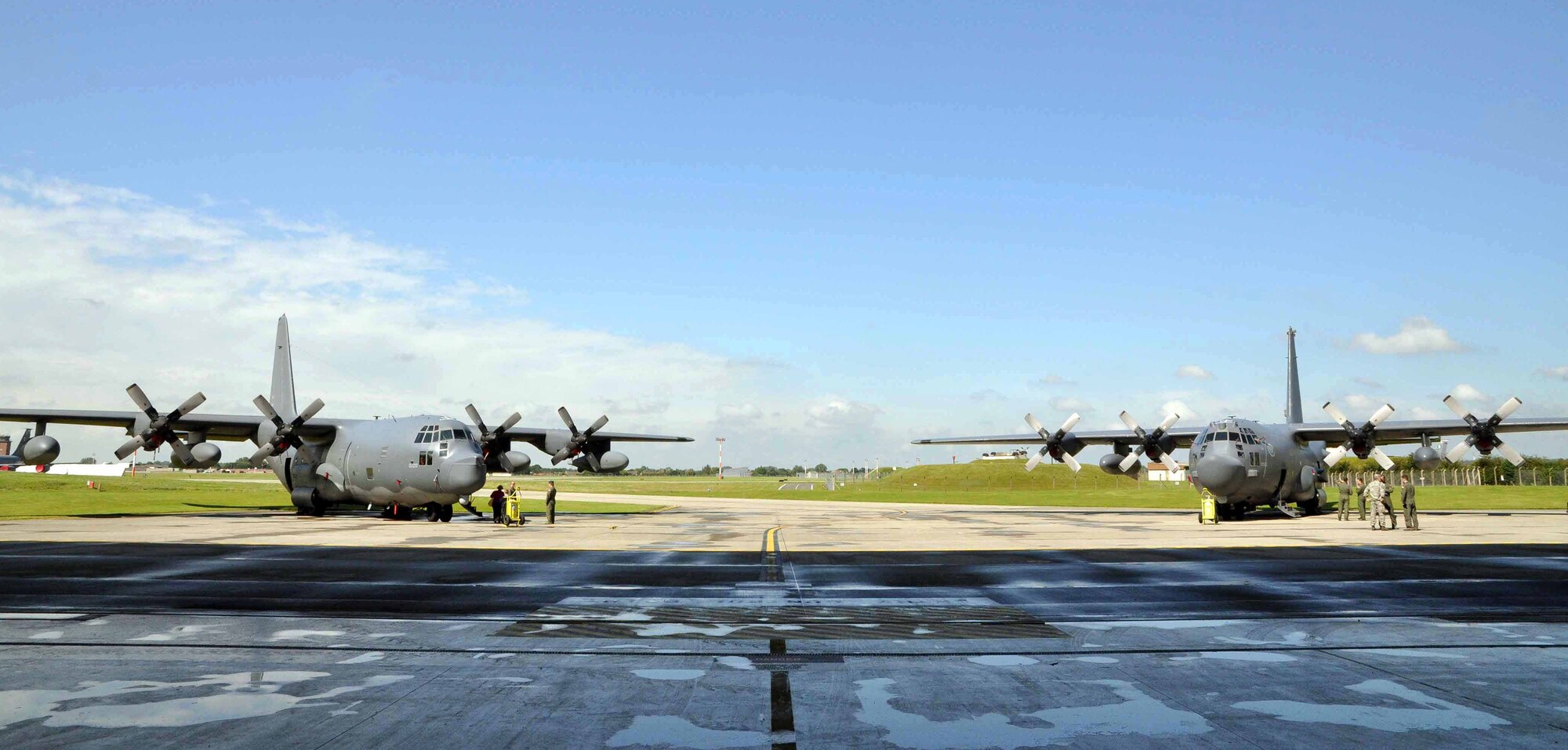 An MC-130P Combat Shadow and an MC-130H Combat Talon II were on display at the change of command ceremony for the 352nd Special Operations group at RAF Mildenhall, England, in Hangar 814 July 6, 2012. Lt. Gen. Eric E. Fiel, Air Force Special Operations Command commander, officiated the ceremony in which Col. Gary McCollum relinquished command of the unit, following four years of service, to Col. Christopher Ireland. (U.S. Air Force photo/Staff Sgt. Thomas Trower)