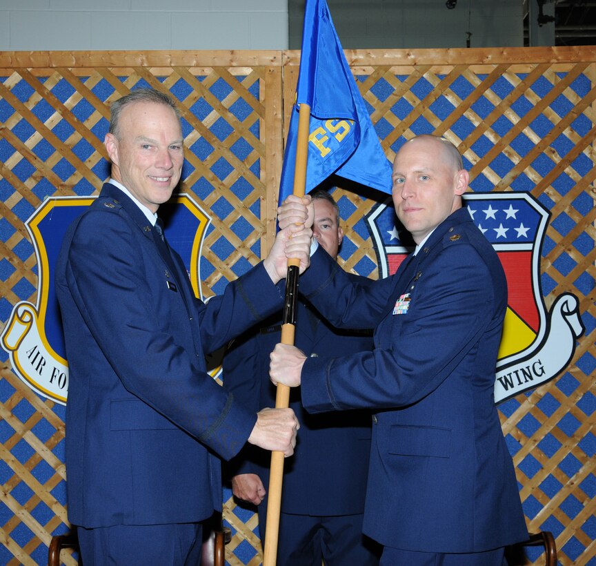 WRIGHT-PATTERSON AIR FORCE BASE, Ohio – Lt. Col. Dale Bateman, 445th Mission Support Group commander, passes the guidon to Maj. Leland Shea, incoming 445th Force Support Squadron commander, during an Appointment of Command ceremony June 2. (U.S. Air Force photo/Tech. Sgt. Anthony G. Springer)