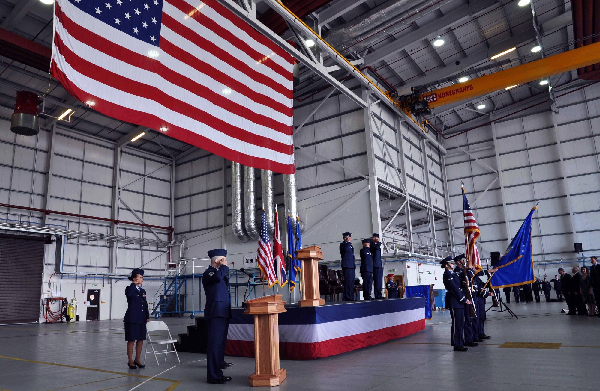 The British and American national anthems are played to begin a change of command ceremony for the 352nd Special Operations group at RAF Mildenhall, England, in Hangar 814 July 6, 2012. Col. Gary McCollum relinquished command of the unit, following four years of service, to Col. Christopher Ireland. (U.S. Air Force photo/Staff Sgt. Thomas Trower)