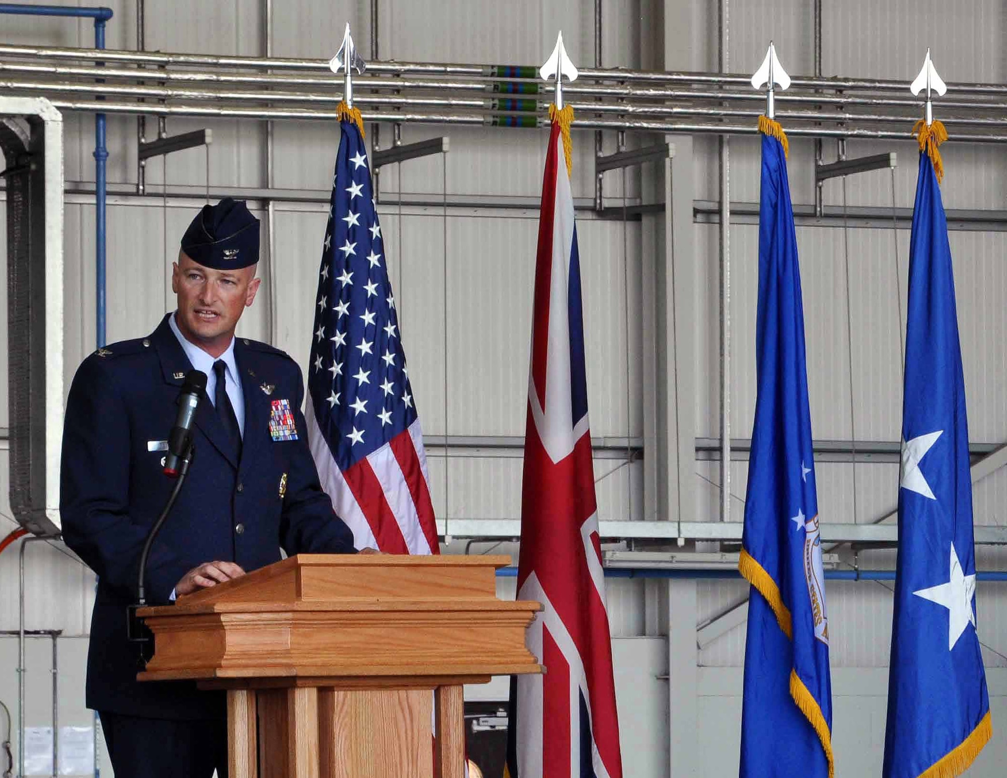 Col. Christopher Ireland, addresses the Airmen of the 352nd Special Operations Group upon assuming command of the unit during a change of command ceremony at RAF Mildenhall, England, in Hangar 814 July 6, 2012. Lt. Gen. Eric E. Fiel, Air Force Special Operations Command commander, officiated the ceremony in which Col. Gary McCollum relinquished command after four years with the unit. (U.S. Air Force photo/Staff Sgt. Thomas Trower)