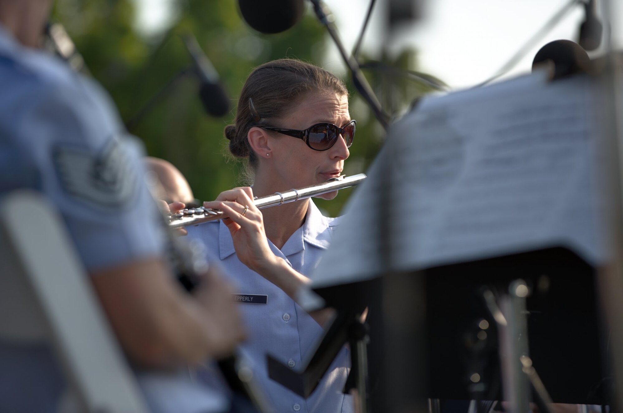 Tech. Sgt. Anne Epperly,  U.S. Air Force Heritage of America Concert Band flutist, performs in front of hundreds of spectators during a concert in Williamsburg, Va., July 4, 2012.  The concert marked the first time the band performed an Independence Day show in Williamsburg, a city with a history dating back to the Revolutionary War. (U.S. Air Force photo by Tech. Sgt. Barry Loo/Released)