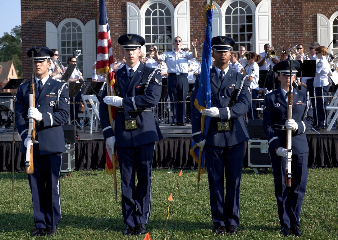 Langley Air Force Base Honor Guard members present the colors while the U.S. Air Force Heritage of America Concert Band plays the National Anthem at Williamsburg, Va., July 4, 2012. The Honor Guard and band members represented the Air Force through music and ceremony, during a free concert celebrating Independence Day. (U.S. Air Force photo by Tech. Sgt. Barry Loo/Released)