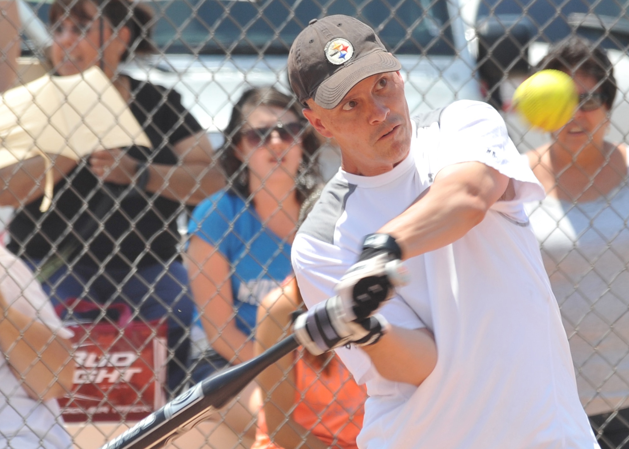 KIRTLAND AFB, N.M. -- Chief Master Sgt . John A. Dougherty, Air Force Nuclear Weapons Center and 377th Air Base Wing command chief, squares up a pitch July 3 during the Chiefs vs. Eagles softball game at Kirtland Air Force Base. The chiefs came out on top, 17-14. (Photo by Todd Berenger)