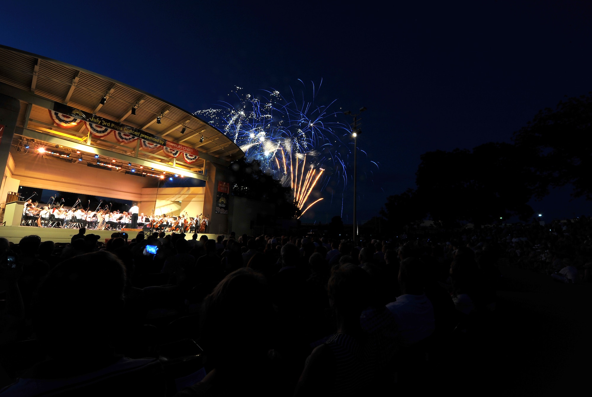 SAN ANGELO, Texas-- The San Angelo Symphony's July 3rd Pops Concert crowd watches as fireworks go off at the Bill Aylor Sr. Memorial River Stage. The event consisted of songs played by the Community Band and San Angelo Symphony, a B-1 Bomber flyover, and a fireworks show. (U.S. Air Force photo/Airman 1st Class Michael Smith)