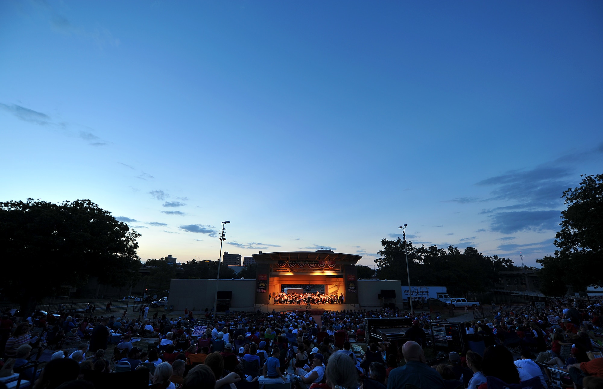 SAN ANGELO, Texas-- Thousands of people wait for the start of San Angelo Symphony's July 3rd Pops Concert firework show at the Bill Aylor Sr. Memorial River Stage. The event consisted of songs played by the Community Band and San Angelo Symphony, a B-1 Bomber flyover, and a fireworks show. (U.S. Air Force photo/Airman 1st Class Michael Smith)