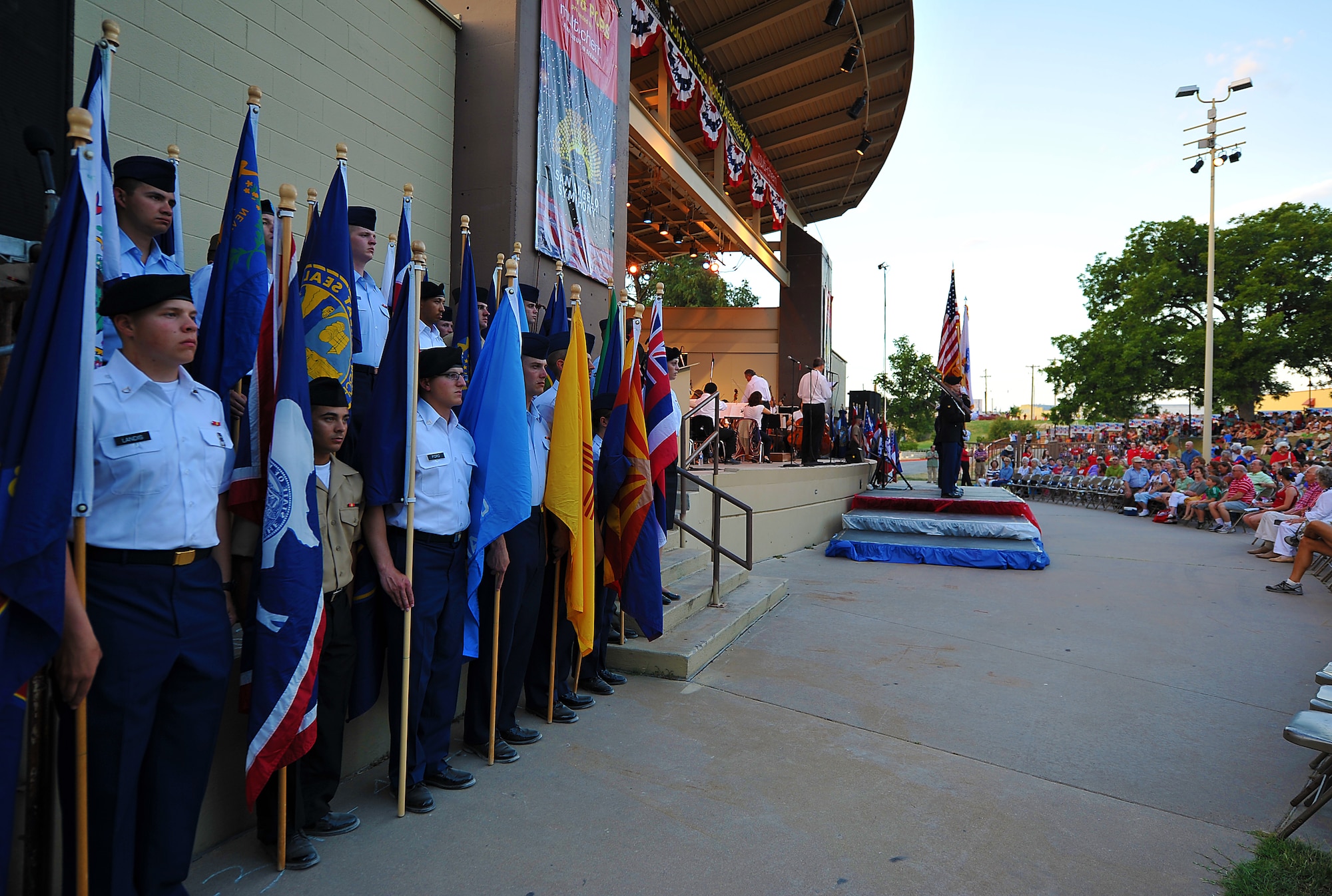 SAN ANGELO, Texas-- Team Goodfellow service members hold state flags during the San Angelo Symphony's July 3rd Pops Concert at the Bill Aylor Sr. Memorial River Stage. Service members from each military branch volunteered to help which contributed to the success of the event. (U.S. Air Force photo/Airman 1st Class Michael Smith)
