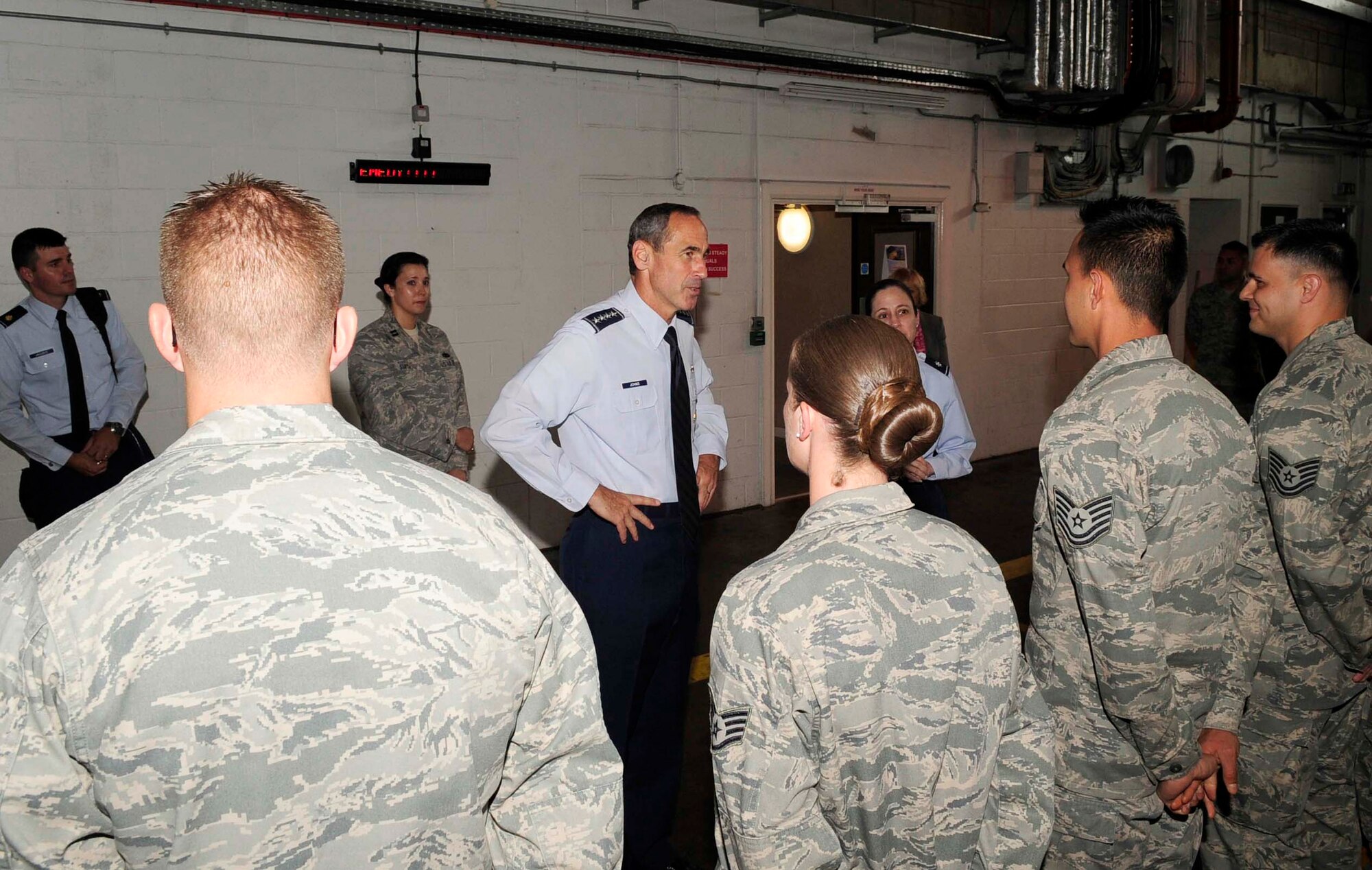 RAF MILDENHALL, England – Gen. Raymond Johns, Air Mobility Command commander, meets Airmen from the 727th Air Mobility Squadron during a site visit here, July 5, 2012. The 727th AMS is a tenant unit based out of RAF Mildenhall. (U.S. Air Force photo/Senior Airman Ethan Morgan)