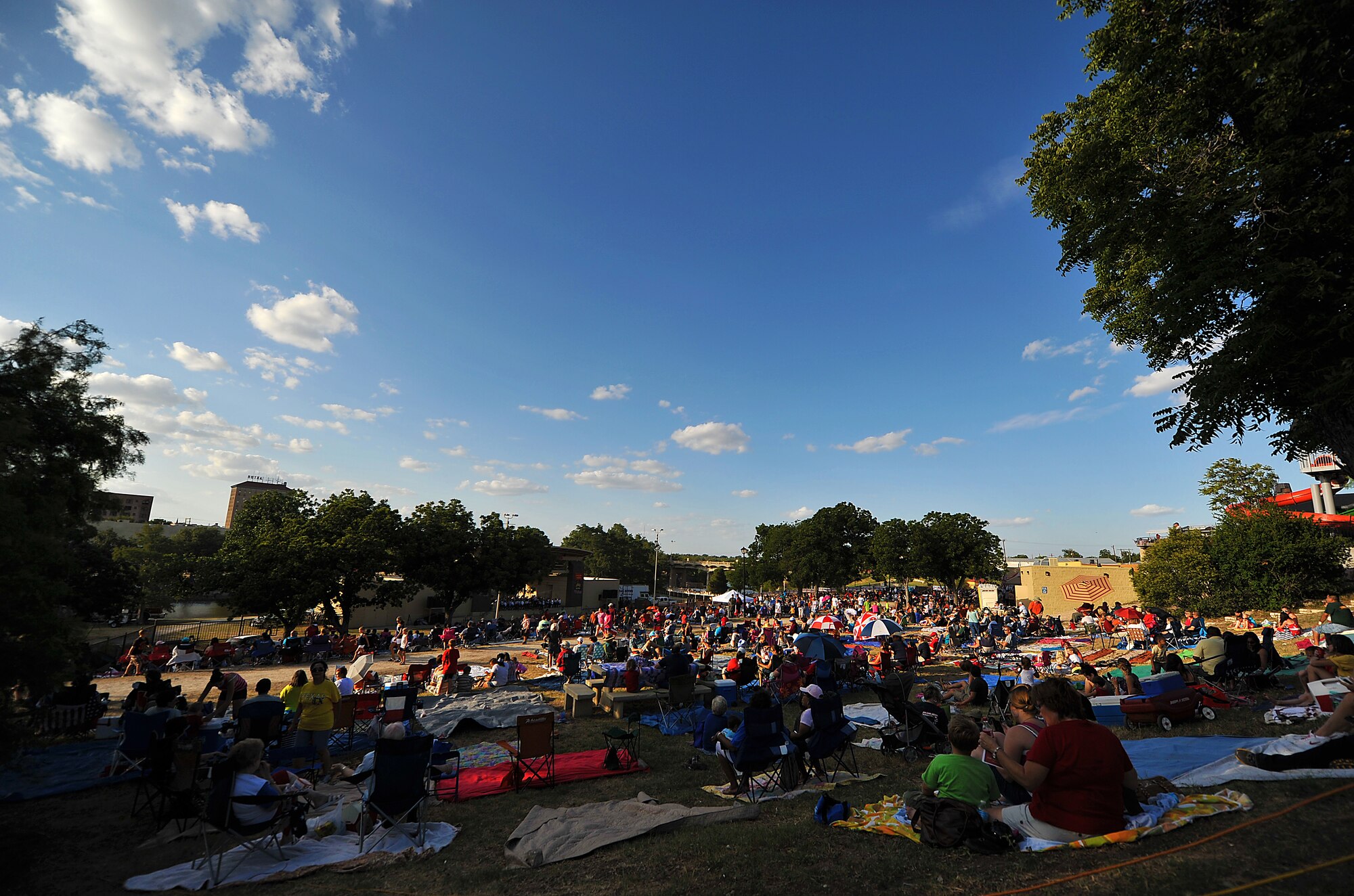 SAN ANGELO, Texas-- Thousands of people gather for the San Angelo Symphony's July 3rd Pops Concert at the Bill Aylor Sr. Memorial River Stage. The event consisted of songs played by the Community Band and San Angelo Symphony, a B-1 Bomber flyover, and a fireworks show. (U.S. Air Force photo/Airman 1st Class Michael Smith)