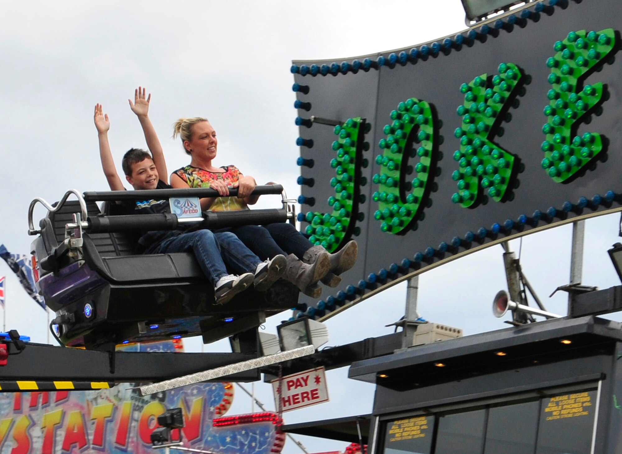 ROYAL AIR FORCE FELTWELL, England – Event participants ride the “Joker” during the Independence Day celebration here July 4, 2012. Approximately 30,000 Airmen, civilians and U.K. residents attended the event. The celebration included carnival games, rides, aerial demonstrations, a birds of prey demonstration and an Idols World Tour performance. (U.S. Air Force by Senior Airman Tiffany M. Deuel)