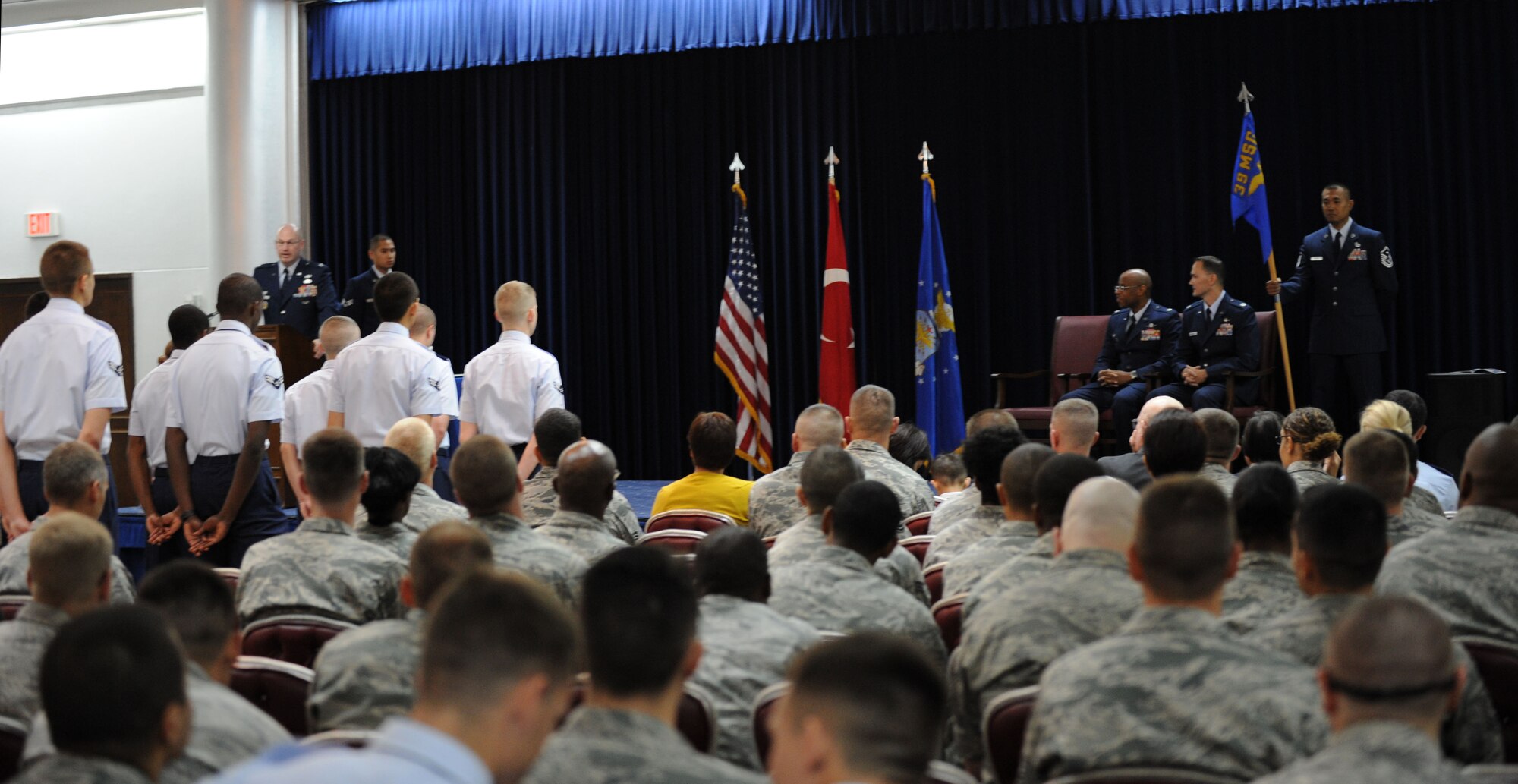 The audience watches as the 39th Communications Squadron proceeds with their change-of-command ceremony July 6, 2012, at Incirlik Air Base, Turkey. Members of the 39th CS bid farewell to Lt. Col. Patrick Daniel and welcomed Lt. Col. James Skelton as their new squadron commander. (U.S. Air Force photo by Senior Airman Jarvie Z. Wallace/Released)