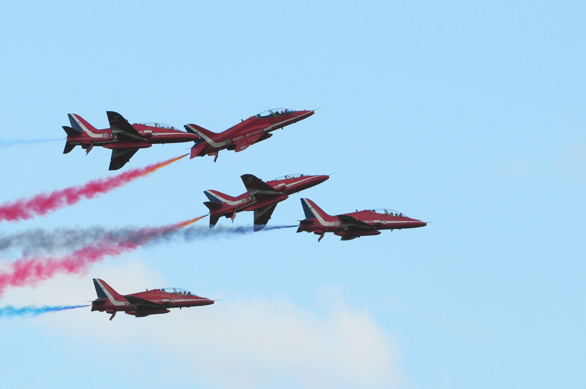 ROYAL AIR FORCE FELTWELL, England - The Royal Air Force Red Arrows Aerobatic Team perform during the Independence Day celebration here July 4, 2012. Approximately 30,000 Airmen, civilians and U.K. residents attended the event. The celebration included carnival games, rides, aerial demonstrations, a birds of prey demonstration and an Idols World Tour performance. (U.S. Air Force by Airman 1st Class Cory D. Payne)