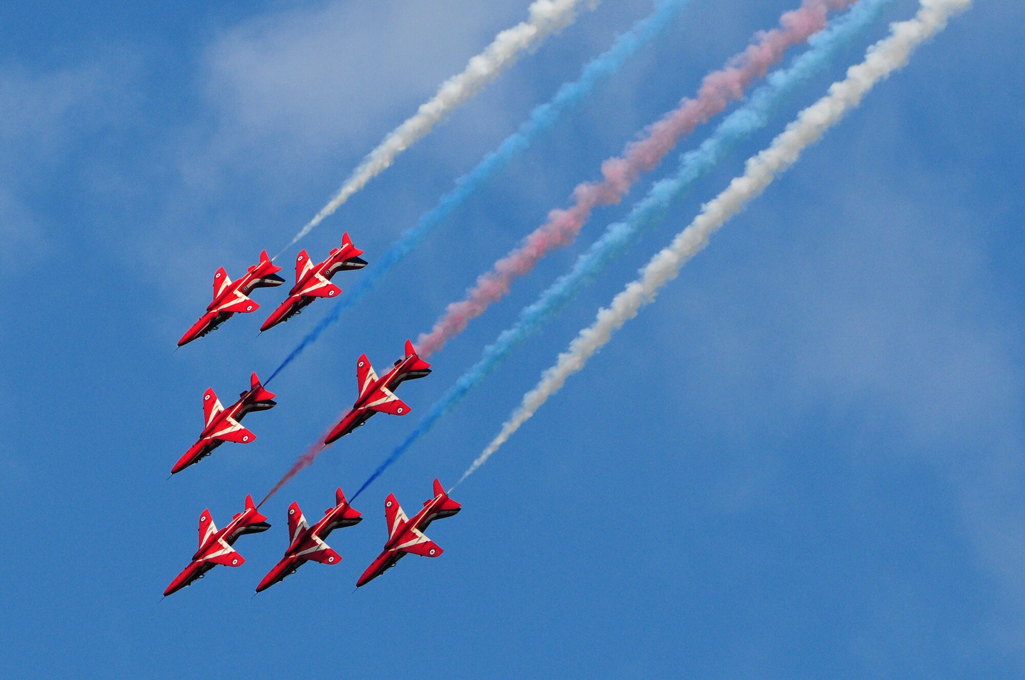 ROYAL AIR FORCE FELTWELL, England - The Royal Air Force Red Arrows Aerobatic Team perform during the Independence Day celebration here July 4, 2012. Approximately 30,000 Airmen, civilians and U.K. residents attended the event. The celebration included carnival games, rides, aerial demonstrations, a birds of prey demonstration and an Idols World Tour performance. (U.S. Air Force by Airman 1st Class Cory D. Payne)