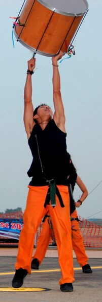 A drummer from Noridan, a Korean percussion group, entertained an audience at the second stage of Liberty Fest, July 4, 2012.  The eight-person troupe traded in their drums for a rolling music machine, and they played toe-tapping music for more than 20 minutes. The holiday celebration was sponsored by the 51st Force Support Squadron at Osan. (U.S. Air Force photo/Senior Master Sgt. Stuart Camp)