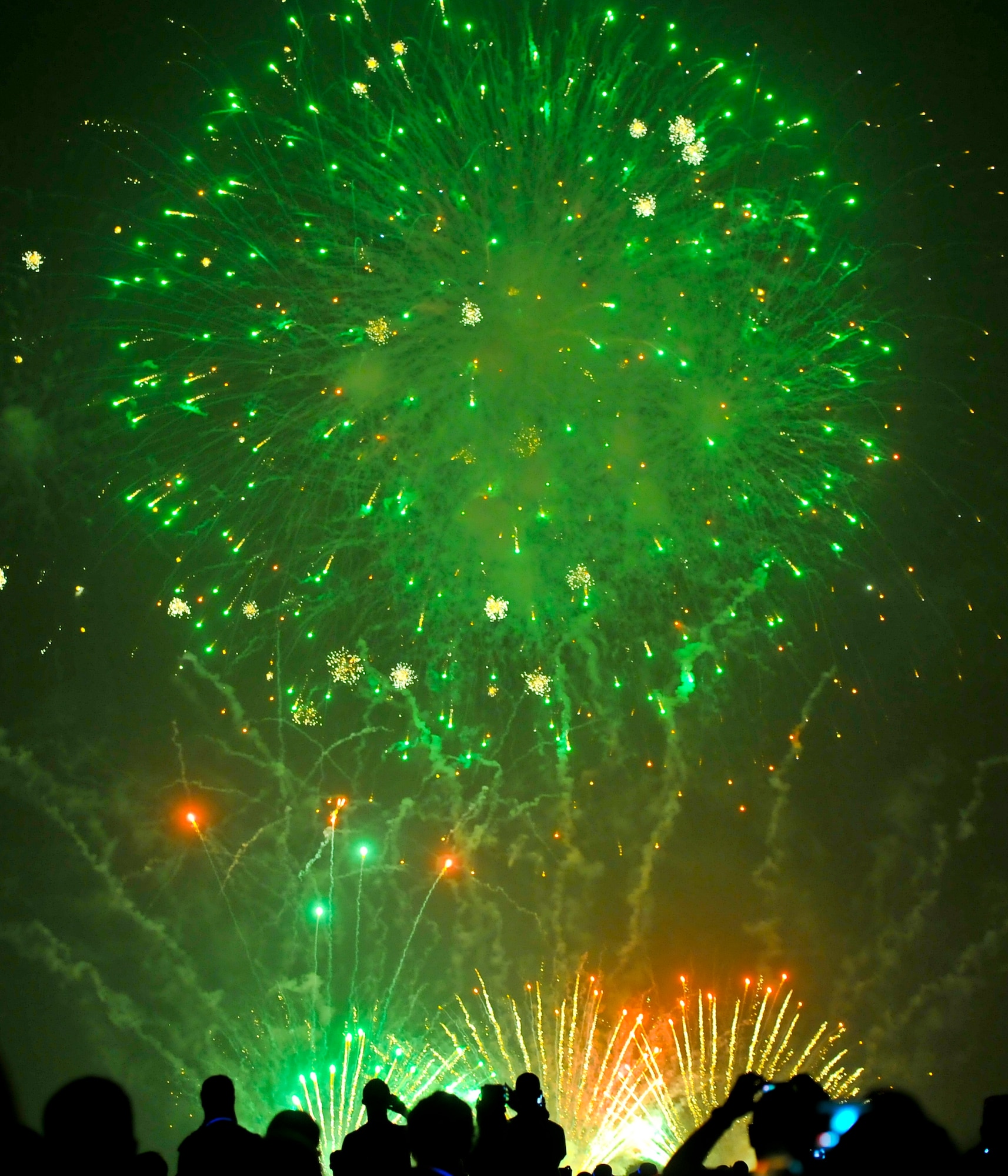 Fireworks paint the sky green at Osan Air Base’s annual Liberty Fest, July 4, 2012, to celebrate Independence Day. Activities to include a golf tournament, dunk booths and live bands were held throughout the day. The annual event was hosted by the 51st Force Support Squadron. (U.S. Air Force photo/Staff Sgt. Stefanie Torres)
