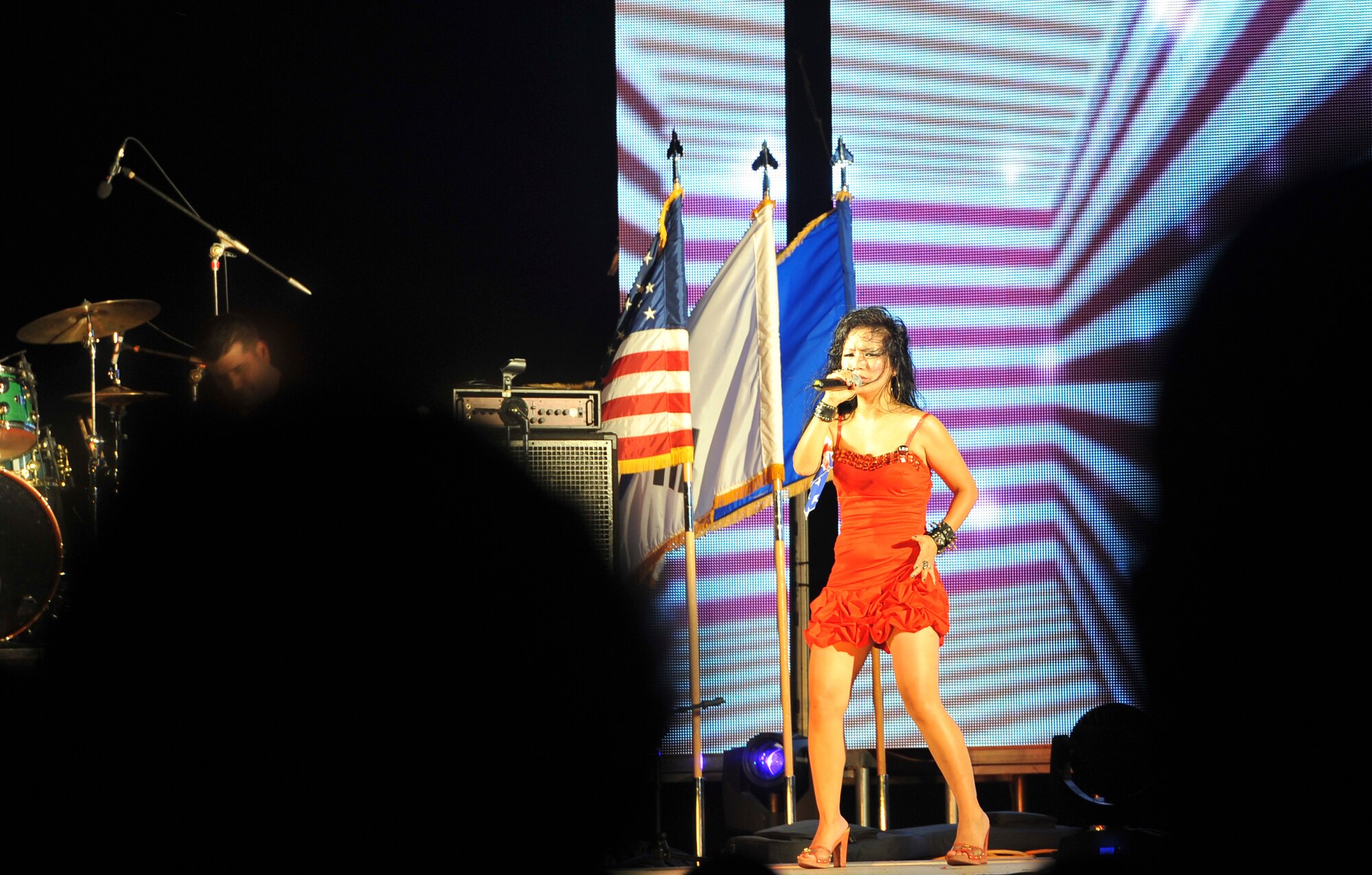 The lead singer of the band LRD performs July 4, 2012, on the main stage during Liberty Fest, a Fourth of July celebration at Osan Air Base, Republic of Korea. After the band’s performance, Col. Patrick McKenzie, 51st Fighter Wing commander, led the countdown to the fireworks show. The 51st Force Support Squadron helped bring a number of activities and live performances to the event. (U.S. Air Force photo/Staff Sgt. Stefanie Torres)