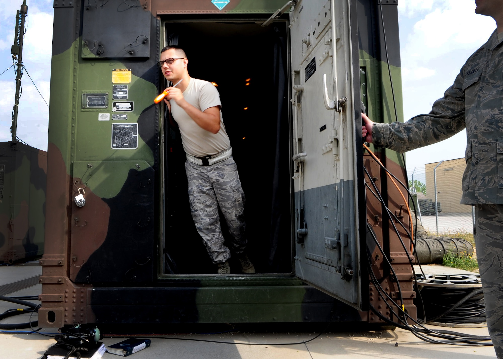 Senior Airman Michael Hoffman, 603rd Air Control Squadron, performs operational checks on radio equipment July 3 at Aviano Air Base, Italy.  The squadron is one of the two Air Force theater air control systems in Europe that will deactivate as part of a larger U.S. Air Force effort to save more than $28 billion in the next five years.  (U.S. Air Force photo by Staff Sgt. Evelyn Chavez)