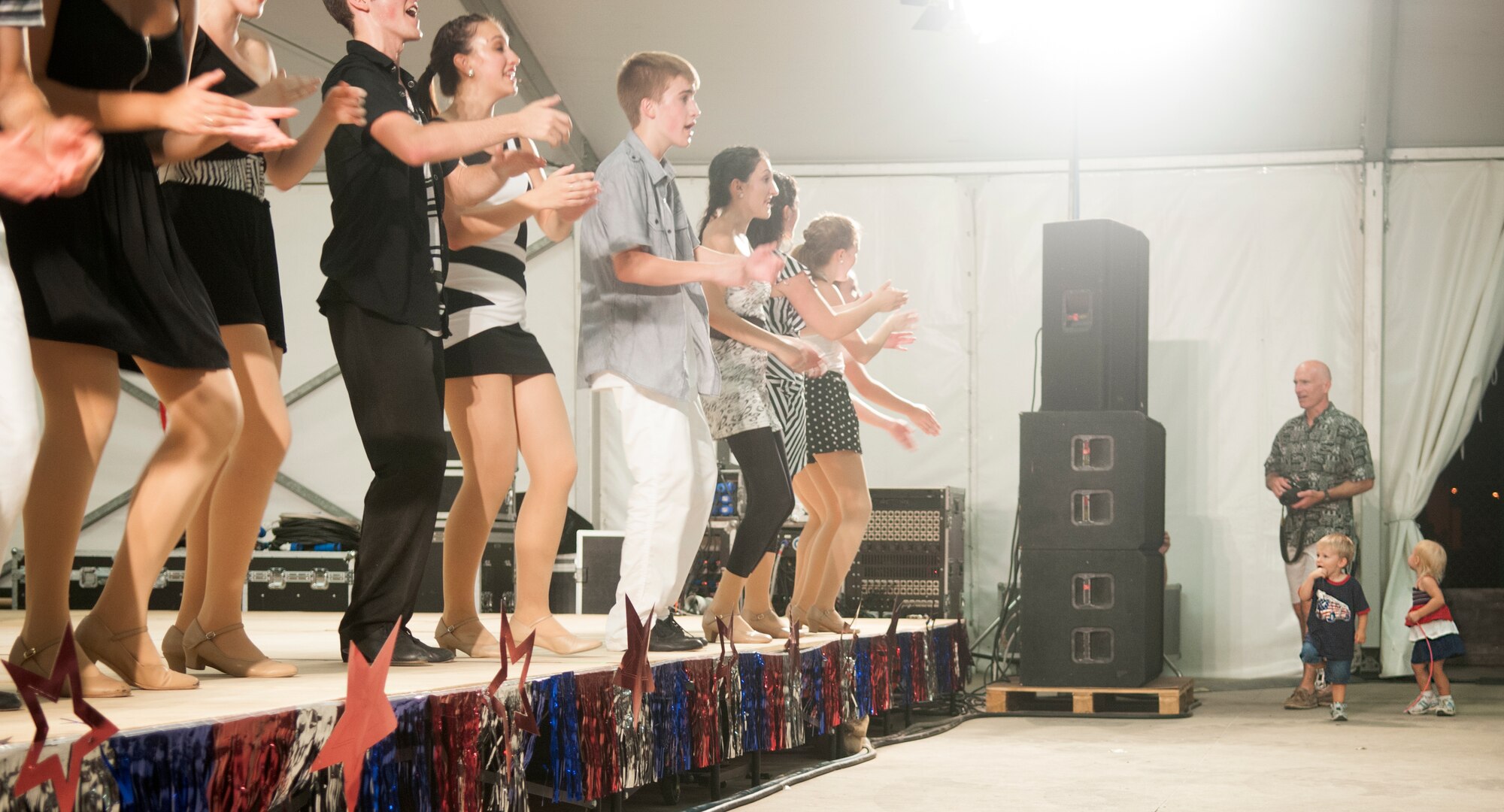 Children dance to a song performed by Electric Youth during Independence Day celebrations at Aviano Air Base July 4. American military members were encouraged to invite Italian friends and neighbors to join in the festivities and more than 400 Italians visited the base during the event. (U.S. Air Force photo/Senior Airman Katherine Windish)