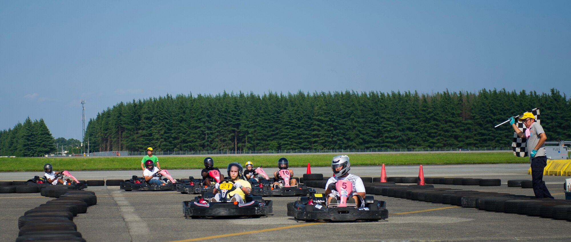 YOKOTA AIR BASE, Japan -- Patrons ride go-carts on the flightline near Hangar 15 during the Celebrate America event held July 4, 2012, at Yokota Air Base, Japan. The festivities also included face painting, carnival games, arts and crafts, and a fireworks show. (U.S. Air Force photo by Staff Sgt. Chad C. Strohmeyer)