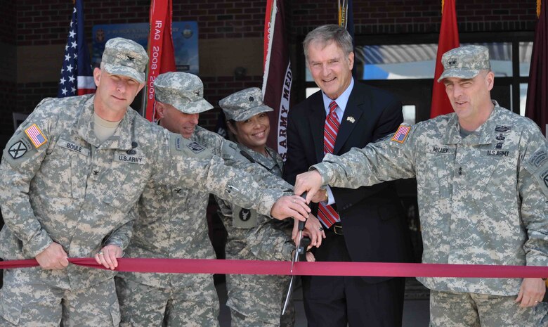 DoD and congressional officials cut the ribbon on a new Warrior in Transition facility at Ft. Drum