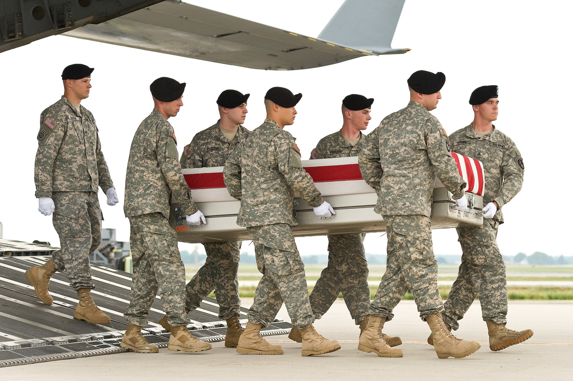 A U.S. Army carry team transfers the remains of Capt. Bruce A. MacFarlane, of Oviedo, Fla., at Dover Air Force Base, Del., July 8, 2012. MacFarlane was assigned to the 1186th Transportation Company, 831st Transportation Battalion, Jacksonville, Fla. (U.S. Air Force photo/Roland Balik)