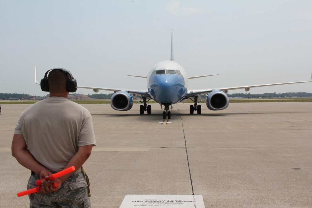 932nd Airlift Wing pilots, flight attendants and maintenance crew members worked together to launch a mission on a hot, muggy, humid Illinois Sunday.  The plane took over early before thunderstorms reached the area.  The Air Force Reserve Command unit flies distinguished visitor missions.  (U.S. Air Force photo/Maj. Stan Paregien)