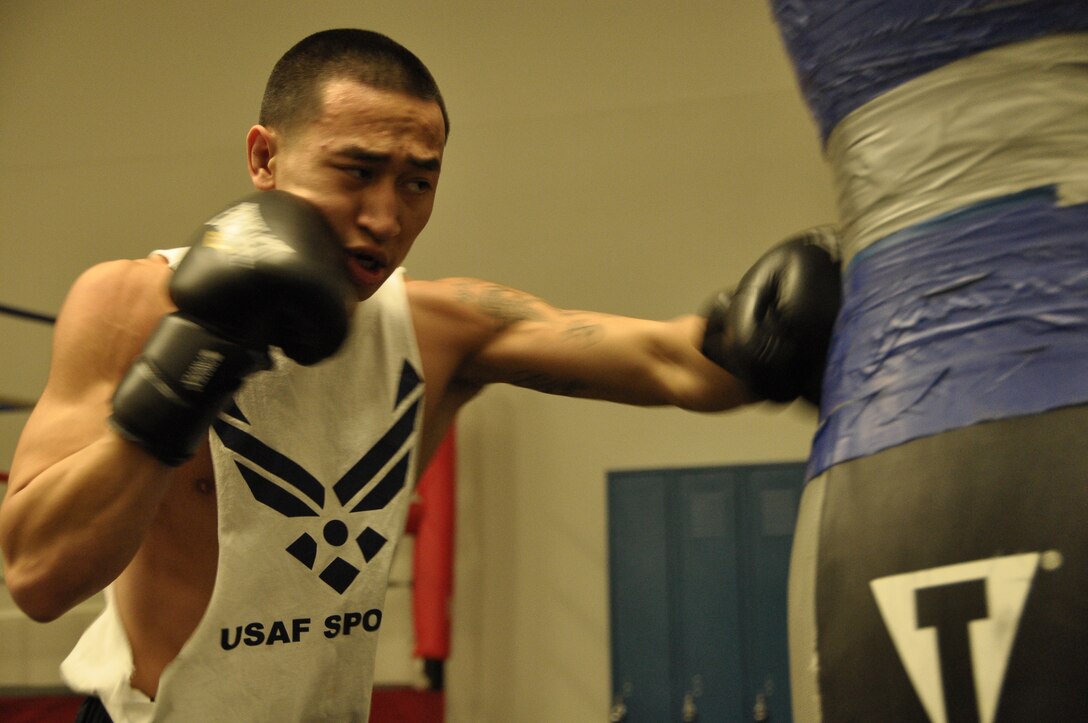 Airman 1st Class Dustin Southichack, 433rd Civil Engineer Squadron and a member of the Air Force Boxing Team, trains in the Chapparal Fitness Center, Joint Base San Antonio-Lackland. The left handed entomologist is in his second year of competition. (U.S. Air Force photo/Senior Airman Brian McGloin)