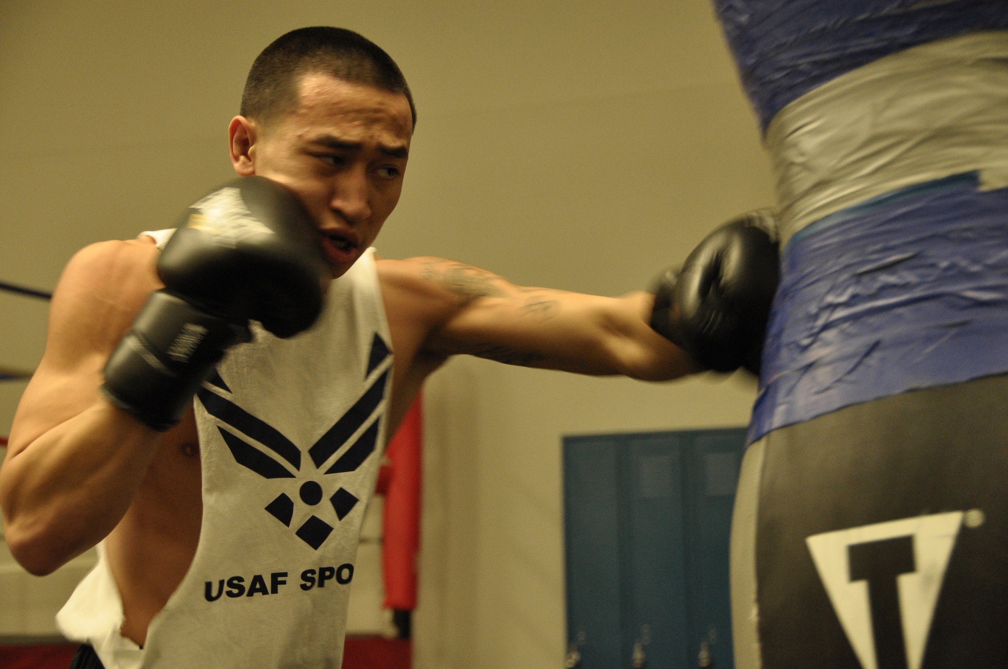 Airman 1st Class Dustin Southichack, 433rd Civil Engineer Squadron and a member of the Air Force Boxing Team, trains in the Chapparal Fitness Center, Joint Base San Antonio-Lackland. The left handed entomologist is in his second year of competition. (U.S. Air Force photo/Senior Airman Brian McGloin)