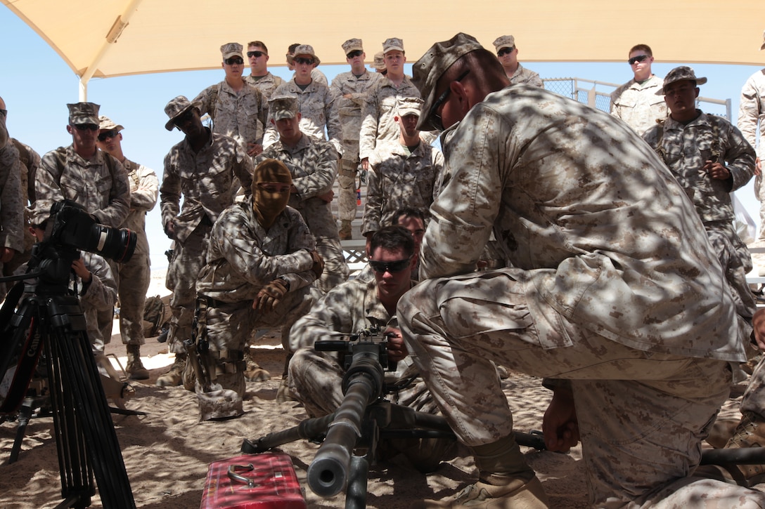 MARINE CORPS AIR GROUND COMBAT CENTER TWENTYNINE PALMS, Calif. - Marines from 1st Marine Expeditionary Brigade, Law Enforcement Battalion receive a class on the M2 .50 caliber machine gun. This class is being given to remediate the Marines prior to live-fire weapons training during Javelin Thrust 2012.  Javelin Thrust is an annual large scale exercise which allows active and reserve Marines and Sailors from 38 different states to train together as a seamless Marine Air Ground Task Force. (Photo by Sgt. Kevin M. Okamura/Released)