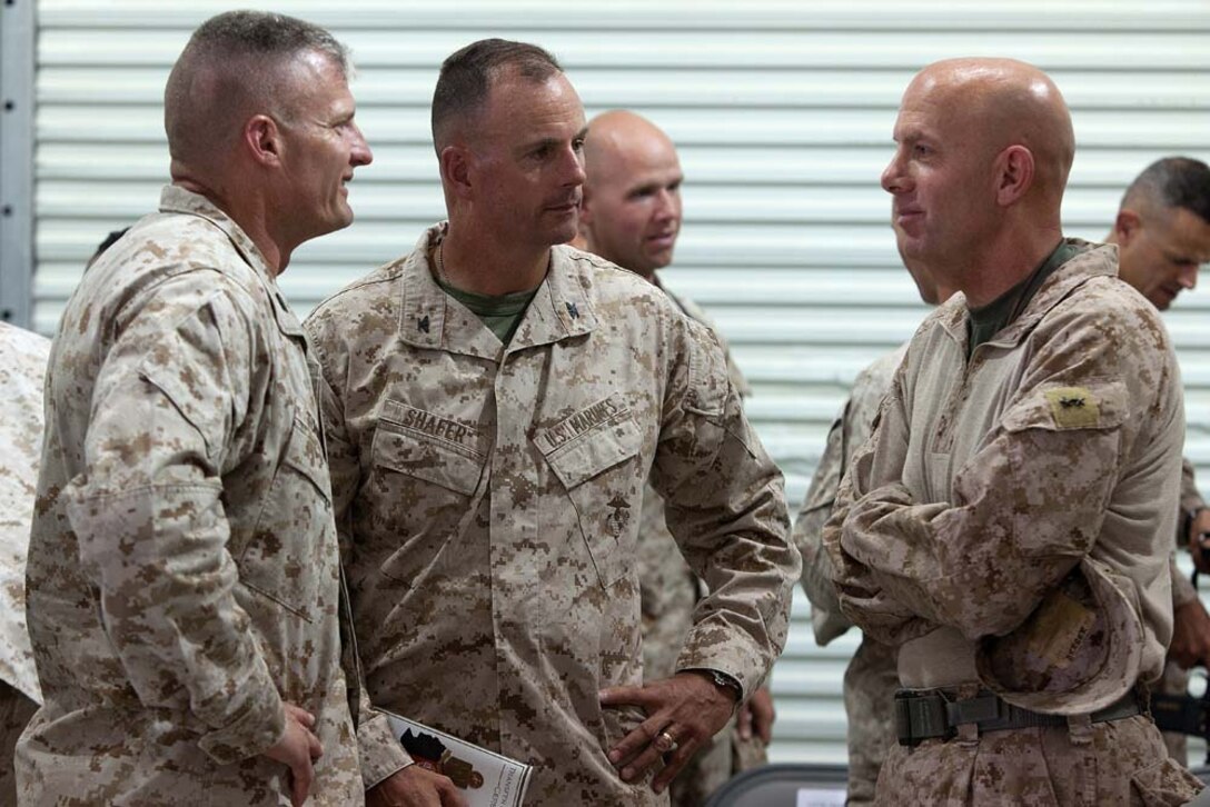 U.S. Marine Col. Roger B. Turner Jr., the commanding officer Regimental Combat Team 5, Col. John R. Shafer, the commanding officer of RCT-6, and Maj. Gen. David Berger, the commanding general of 1st Marine Division (Forward), talk after a transfer of authority ceremony here, July 5, 2012. Since their activation in 1917, 5th and 6th Marine Regiments have courageously fought for America, most notably in World War I when they fought side-by-side in the bloody Battle of Belleau Wood. Since their activation in 1917, 5th and 6th Marine Regiments have courageously fought for America, most notably in World War I when they fought side-by-side in the bloody Battle of Belleau Wood. In December 2011, Regimental Combat Team 6 arrived in northern Helmand province to support Operation Enduring Freedom, joining RCT-5 on the same battlefield for the first time in 94 years. This historic partnership is now coming to a close.  Turner and Sgt. Maj. Alberto Ruiz, the sergeant major of RCT-5, cased the colors of â€œFighting Fifthâ€ and transferred authority of their area of operations to Shafer and Sgt. Maj. Jamie Deets, the sergeant major of RCT-6 here, July 5.