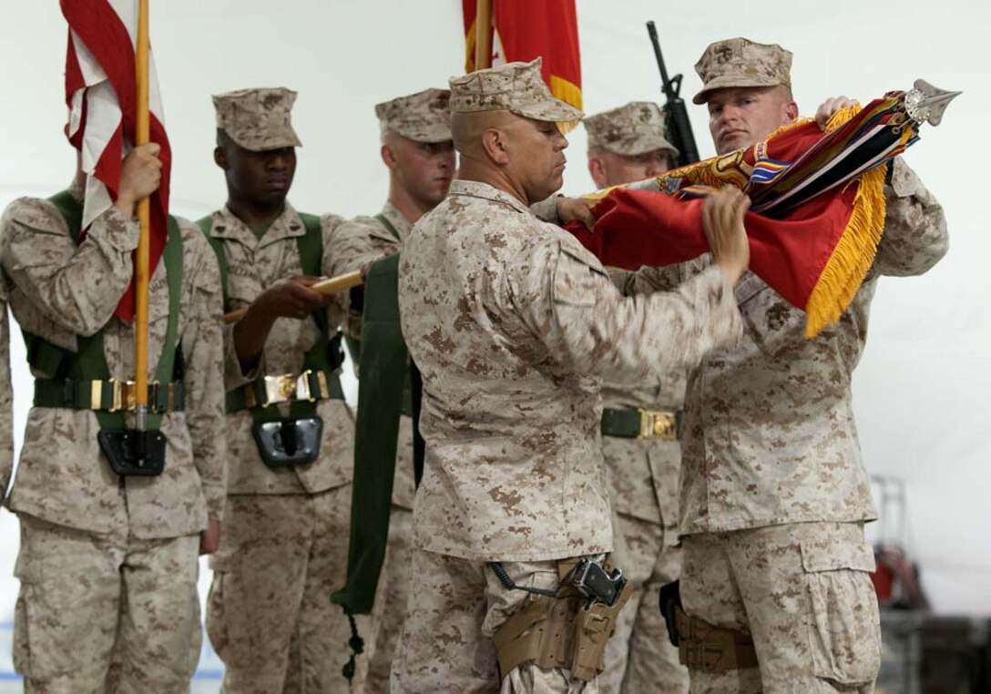 U.S. Marine Col. Roger B. Turner Jr. and Sgt. Maj. Alberto Ruiz, the commanding officer and sergeant major of Regimental Combat Team 5, case the regimental colors during a transfer of authority ceremony here, July 5, 2012. Since their activation in 1917, 5th and 6th Marine Regiments have courageously fought for America, most notably in World War I when they fought side-by-side in the bloody Battle of Belleau Wood. In December 2011, Regimental Combat Team 6 arrived in northern Helmand province to support Operation Enduring Freedom, joining RCT-5 on the same battlefield for the first time in 94 years. This historic partnership is now coming to a close. Turner and Ruiz, the commanding officer and sergeant major of RCT-5, cased the colors of â€œFighting Fifthâ€ and transferred authority of their area of operations to Col. John R. Shafer and Sgt. Maj. Jamie Deets, the commanding officer and sergeant major of RCT-6 here, July 5.