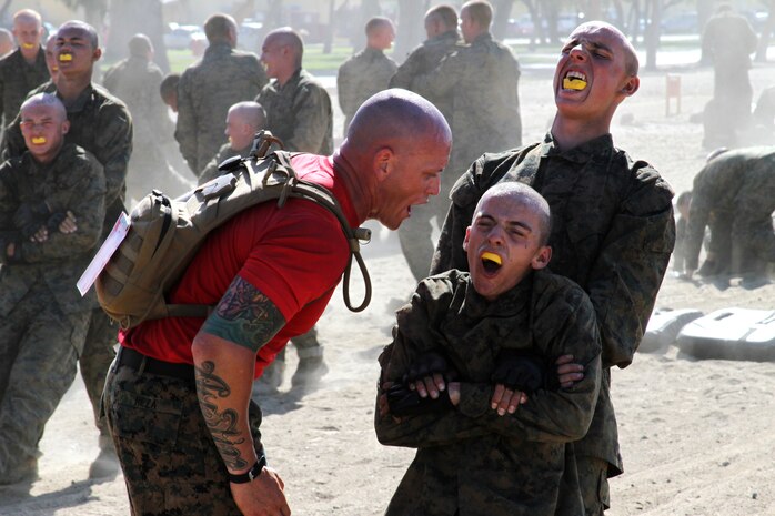 Staff Sgt. Brian Reza, drill instructor, Company B, 1st Recruit Training Battalion, challenges recruits' volume as they war cry from one exercise to another during the Combat Conditioning Exercise aboard Marine Corps Recruit Depot San Diego June 27. Drill instructors motivated recruits during the CCX, pushing them past their limitations, testing them both mentally and physically.