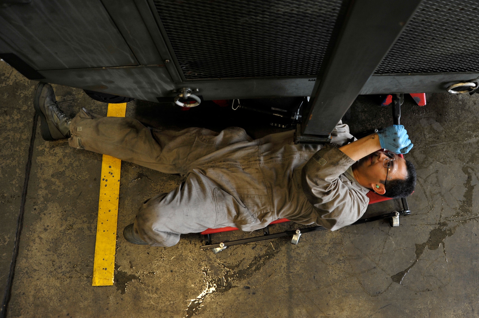 U.S. Air Force Senior Airman Mark Trejo, 35th Maintenance Squadron aerospace ground equipment journeyman, works on a hydraulic test stand at Misawa Air Base, Japan, July 9, 2012. Equipment like this is used to support everyday operations on the flightline, making flight possible for the aircraft here. (U.S. Air Force photo by Staff Sgt. Nathan Lipscomb/Released) 