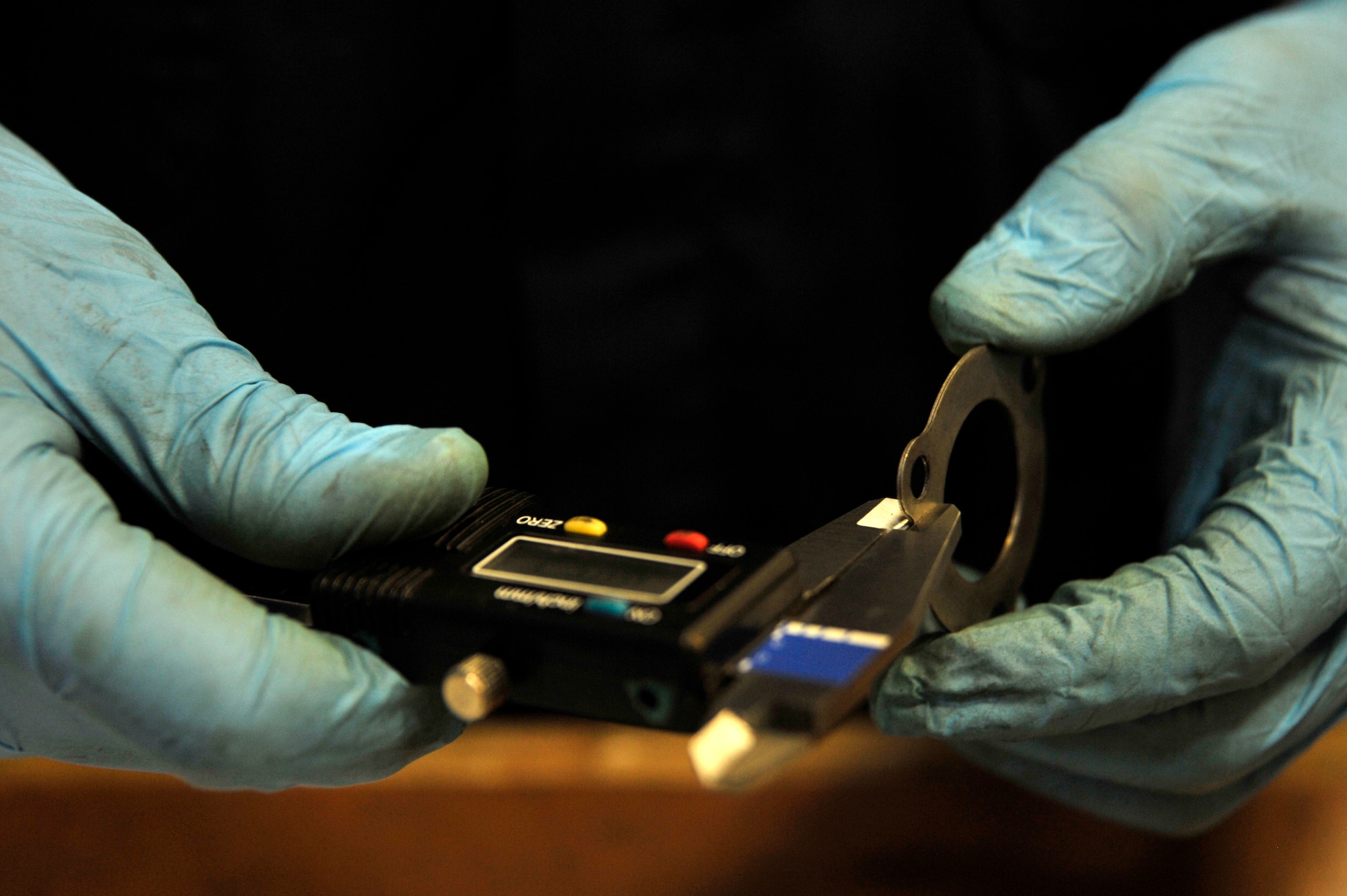 U.S. Air Force Airman 1st Class John Ortiz, 35th Maintenance Squadron aerospace ground equipment apprentice, learns how to perform an annual inspection on a turbine engine combustor at Misawa Air Base, Japan, July 9, 2012. Airmen from the AGE flight perform scheduled and unscheduled maintenance as well as inspect, test, and operate air ground equipment to determine serviceability and proper operation.  (U.S. Air Force photo by Staff Sgt. Nathan Lipscomb/Released) 