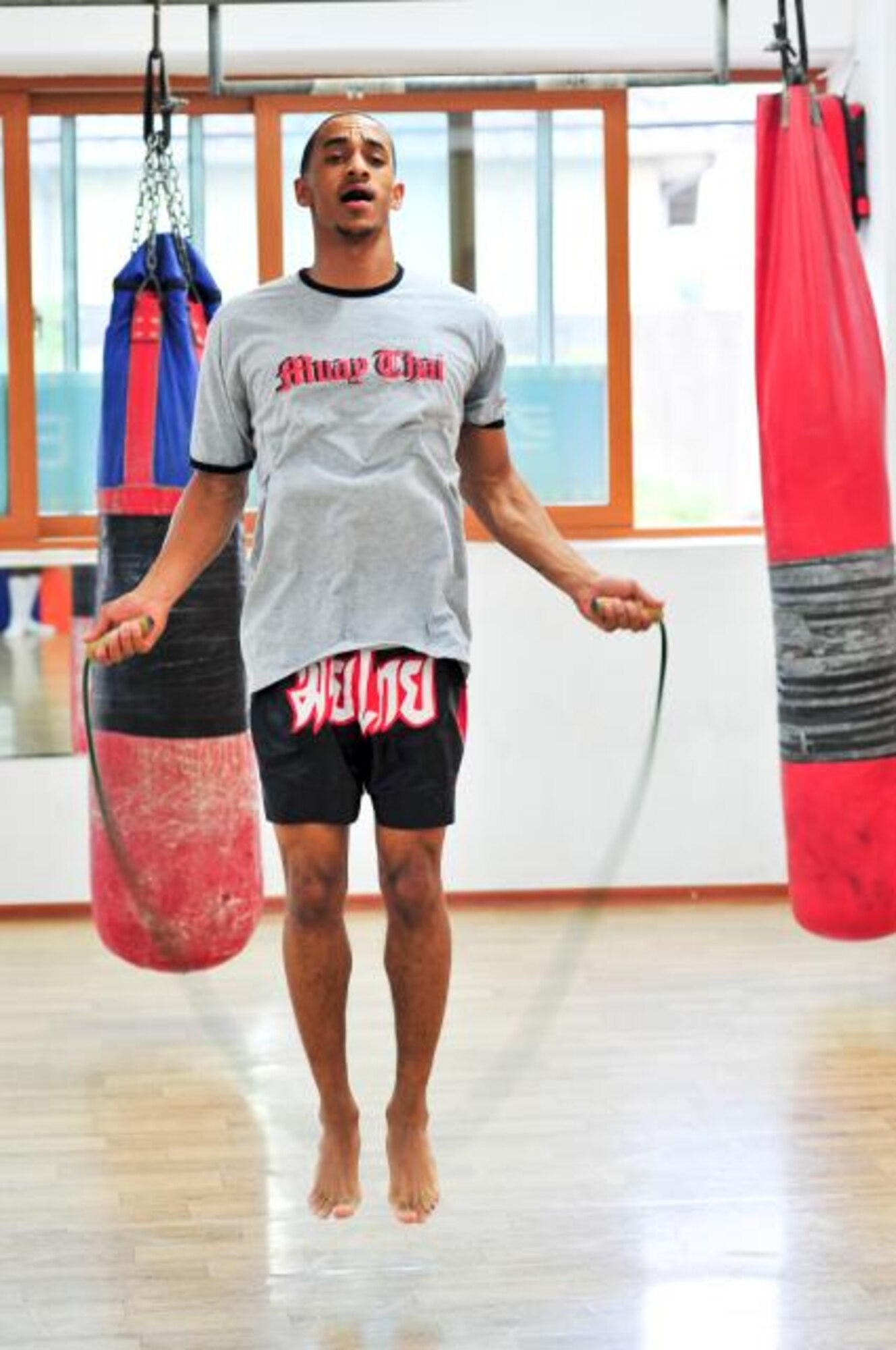 Senior Airman James Turner, 51st Maintenance Group aircraft metal technology journeyman, jumps rope before sparring June 18, 2012. Turner has been participating in Muay Thai at the Moo Bong Gym for about three months and goes there five times a week for two hours per session. (U.S. Air Force photo/Senior Airman Adam Grant)
