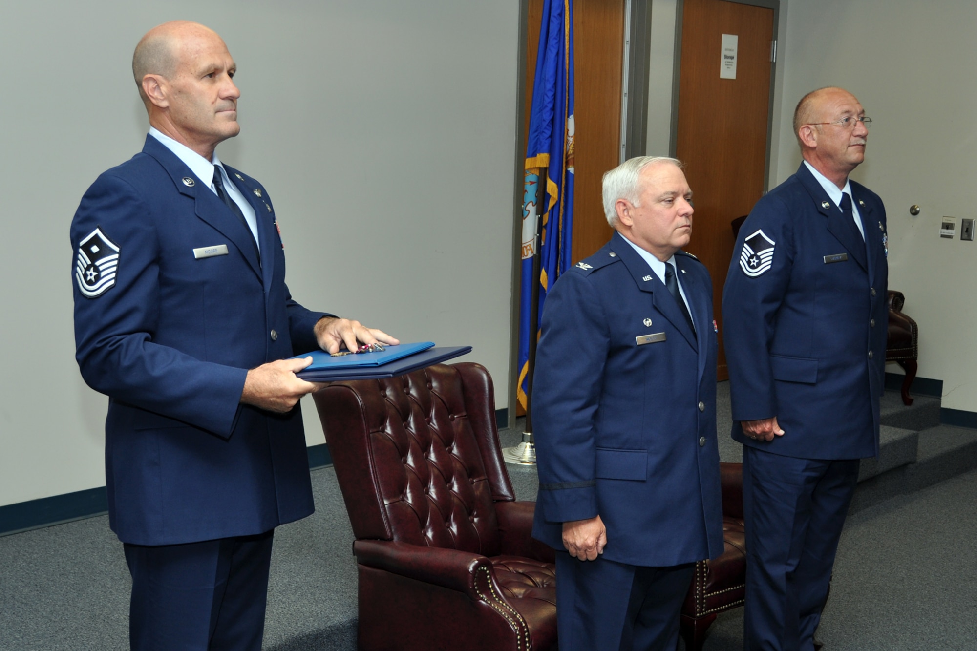 Master Sgt. Darryl Moore, 307th Mission Support Group, first sergeant, Col. Kevin Wolfe, the commander of the 307 MSG and Master Sgt. Harold Starkey stand at attention as a Meritorious Service Medal citation is read during Starkey’s retirement ceremony at Barksdale Air Force Base, La., July 8, 2012. Starkey, who was the 307 MSG career advisor, also served as the Yellow Ribbon Program Manager for the wing. During his 33 years of service to his country, Starkey served in the Air Force as well as the Texas Army National Guard. (U.S. Air Force photo by Master Sgt. Jeff Walston)