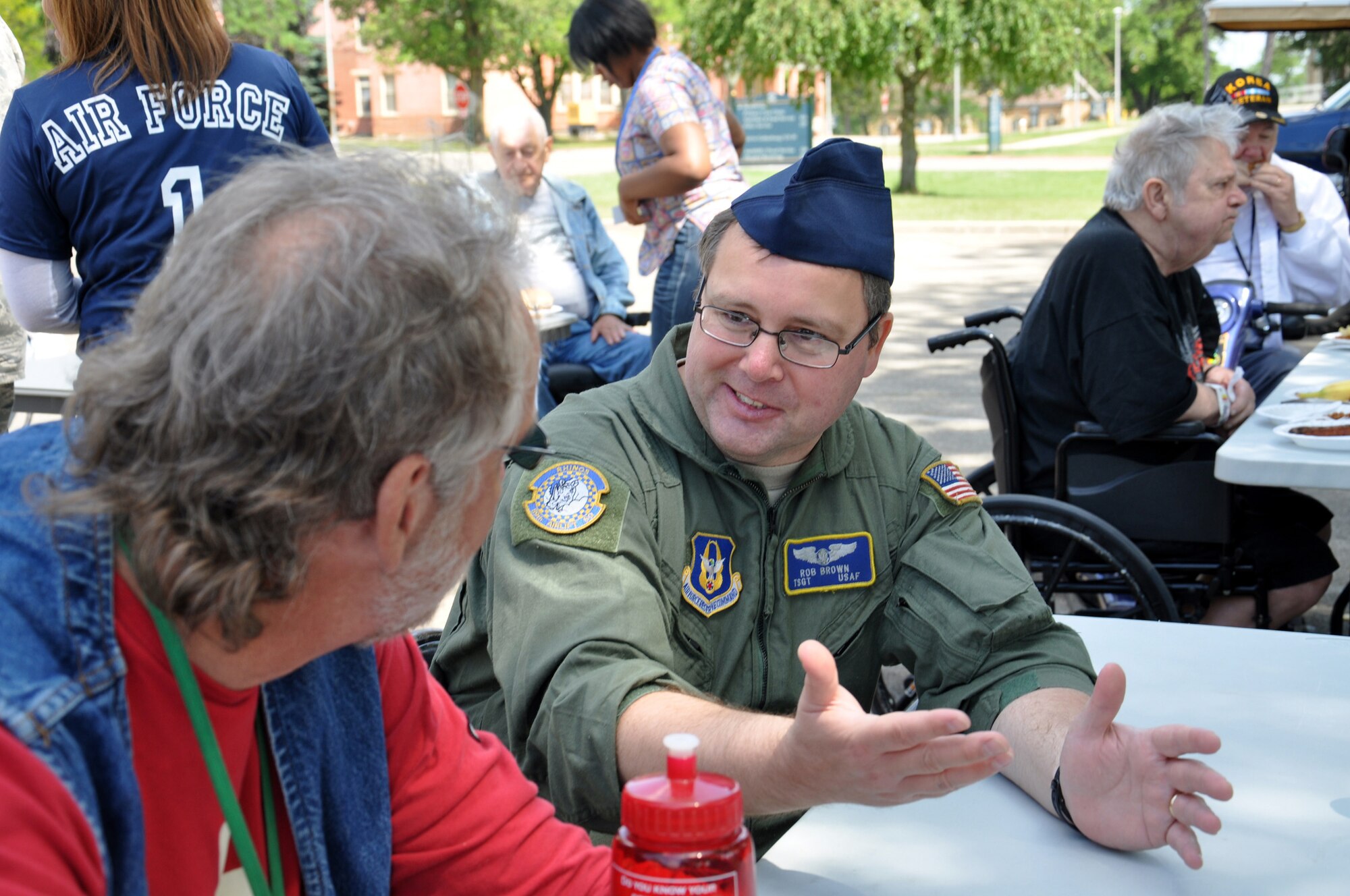 WRIGHT-PATTERSON AIR FORCE BASE, Ohio – Tech. Sgt. Rob Brown, 89th Airlift Squadron loadmaster, enjoys the afternoon with resident and Army veteran David Carr at the Dayton Veterans Affairs Medical Center annual picnic June 2. (U.S. Air Force photo/Master Sgt. Charlie Miller)