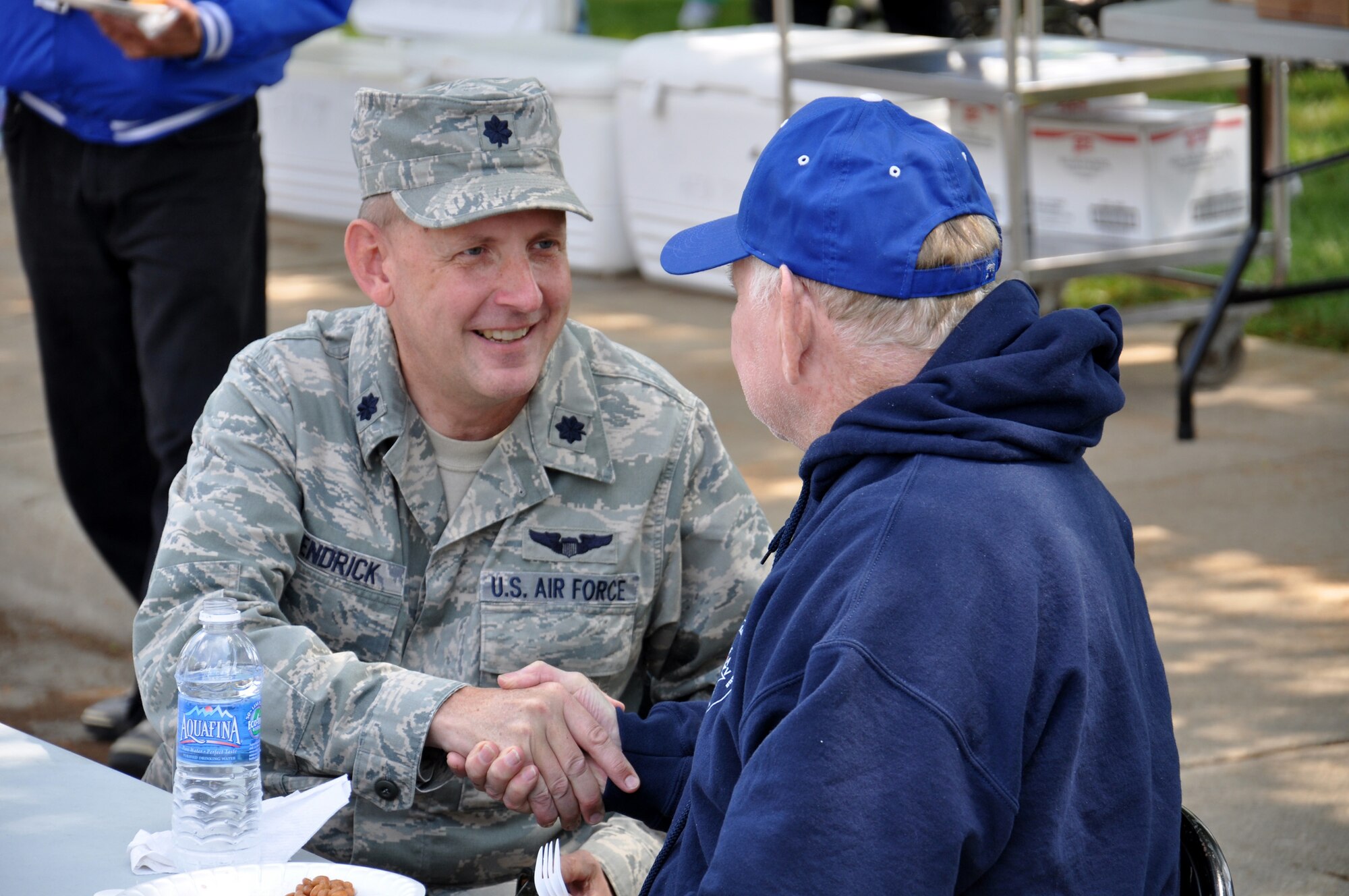 WRIGHT-PATTERSON AIR FORCE BASE, Ohio – Lt. Col. Alan Kendrick, 445th Airlift Wing staff, enjoys the afternoon with resident and Army World War II veteran Charles Couch at the Dayton Veterans Affairs Medical Center annual picnic June 2. (U.S. Air Force photo/Master Sgt. Charlie Miller)