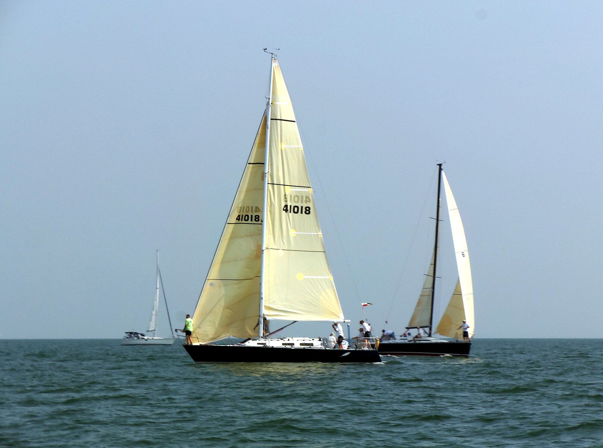 The crew of Feather, a 36 foot sailing yacht, position their boat for the start of the 2012 Veterans’ Cup sailboat race on the Chesapeake Bay July 7, 2012. Always held near the 4th of July holiday, the Veterans Cup is the Langley Yacht Club’s annual keystone race. (U.S. Air Force photo by Tech. Sgt. Randy Redman / Released)