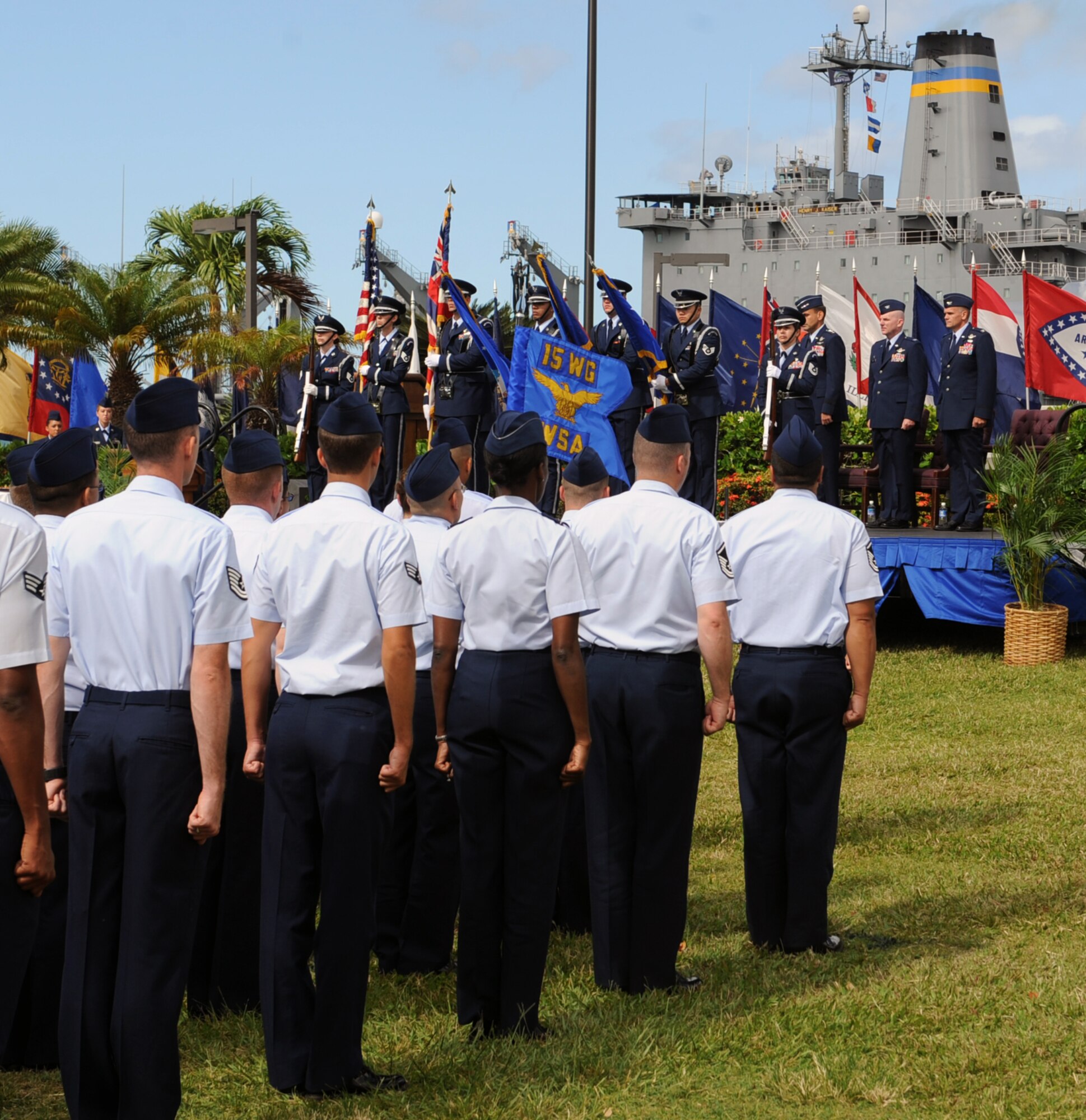 Members of the base honor guard present the colors before the start of the 15th Wing Change of Command ceremony July 6 at Joint Base Pearl Harbor-Hickam, Hawaii. During the ceremony, command of the 15th WG passed from Col. Sam Barrett to Col. Johnny Roscoe. (U.S. Air Force photo by Staff Sgt. Nathan Allen)
