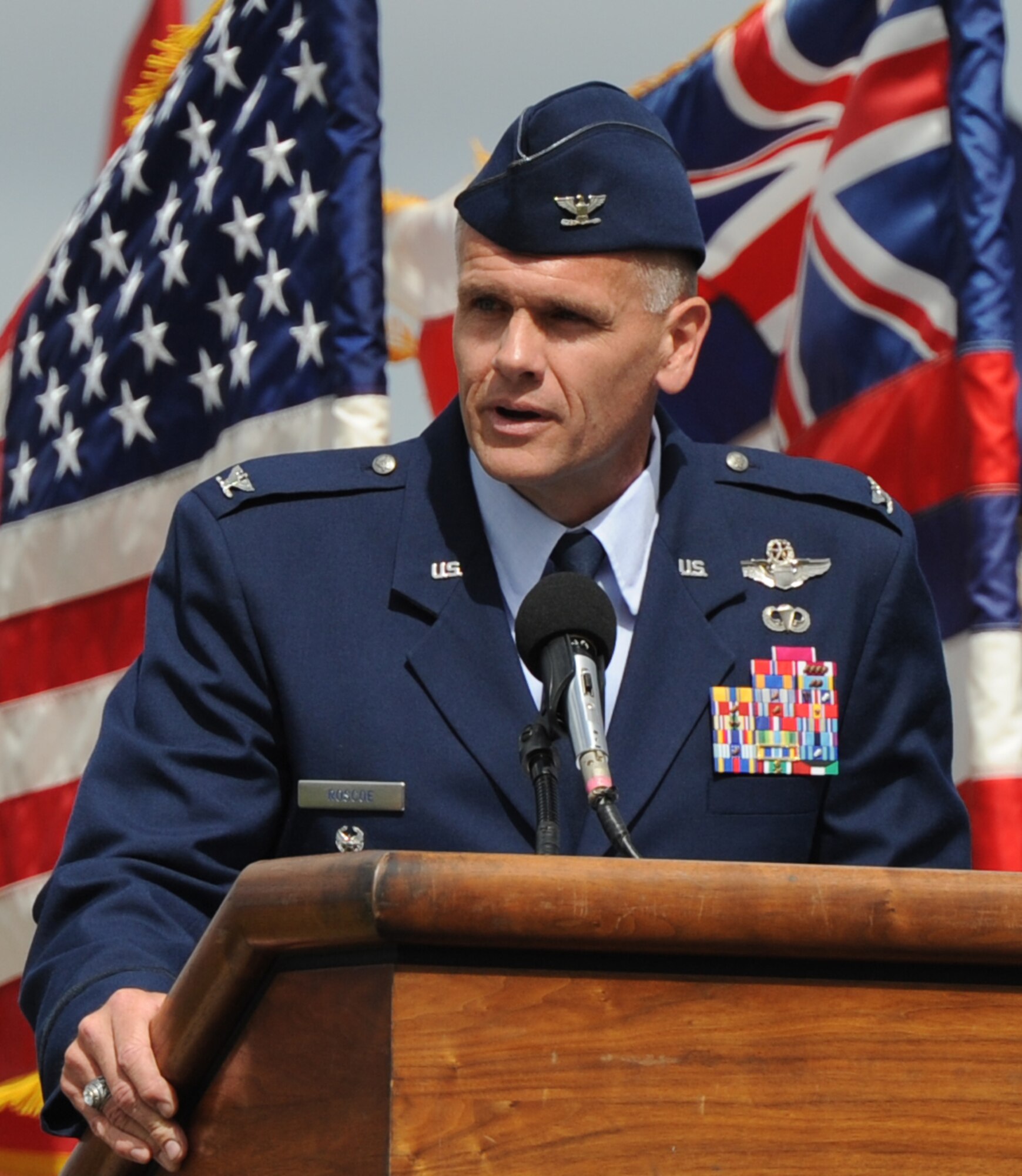 Col. Johnny Roscoe, incoming 15th Wing commander, speaks to attendees at the 15th Wing Change of Command ceremony July 6 at Joint Base Pearl Harbor-Hickam, Hawaii. During the ceremony, command of the 15th WG passed from Col. Sam Barrett to Roscoe. (U.S. Air Force photo by Capt Ben Sakrisson)
