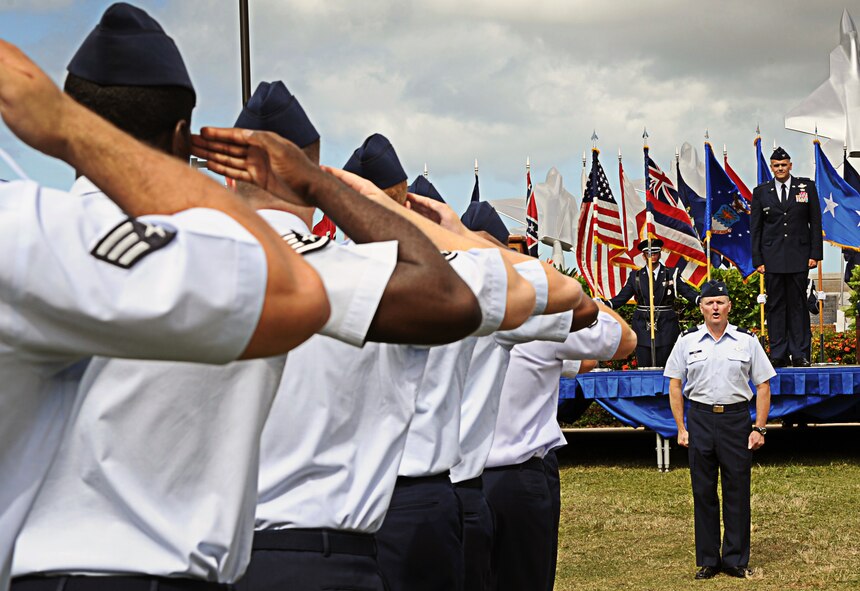 Col. Johnny Roscoe, incoming 15th Wing commander, receives a welcome salute from his new Airmen upon his assumption of command of the 15 WG during the Change of Command ceremony July 6 at Joint Base Pearl Harbor-Hickam, Hawaii. During the ceremony, command of the 15th WG passed from Col. Sam Barrett to Roscoe. (U.S. Air Force photo by Senior Airman Lauren Main)