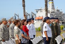 Airmen and civilians from Joint Base Pearl Harbor-Hickam, Hawaii, gather to bid Aloha to Col. Sam Barrett, outgoing 15th Wing commander, and welcome Col. Johnny Roscoe, incoming 15th WG commander, upon his assumption of command during the start of the 15th Wing Change of Command ceremony July 6. During the ceremony, command of the 15th WG passed from Barrett to Roscoe. (U.S. Air Force photo by Senior Airman Lauren Main)