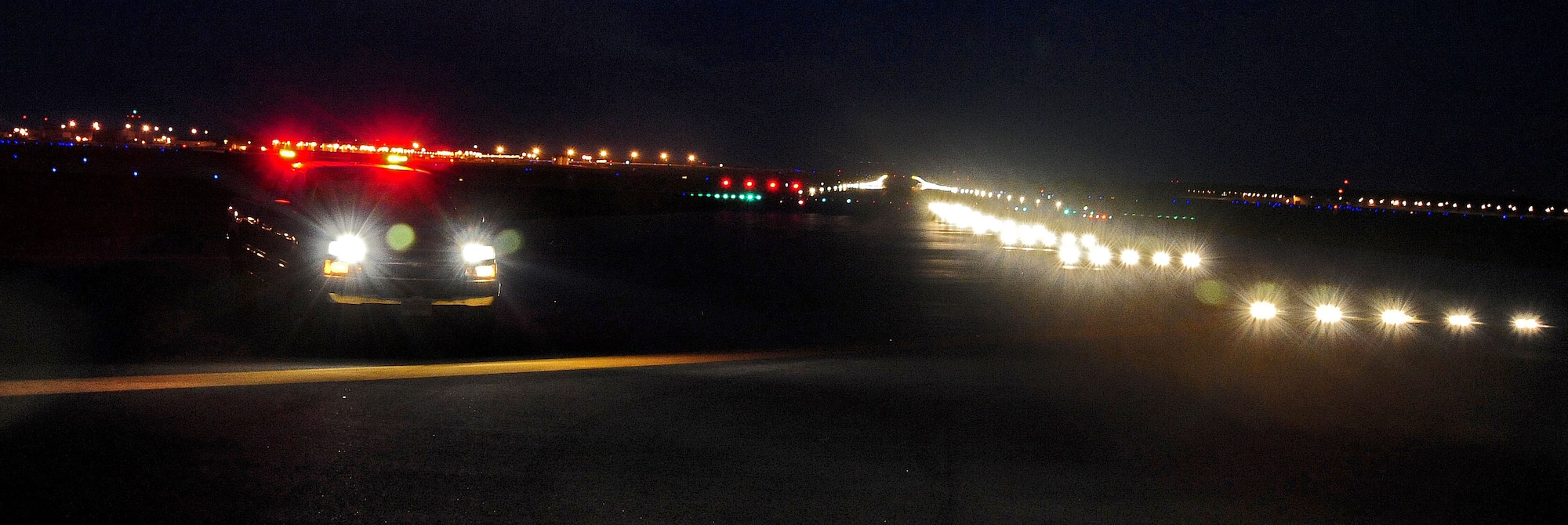 WHITEMAN AIR FORCE BASE, Mo. -- A member from the 509th Operations Support Squadron airfield management operations flight ensure lights on the runway are visible to the pilots in the air during a daily inspection June 30. Daily inspections are done to ensure the airfield is ready to support operations at all times. (U.S. Air Force photo/Senior Airman Nick Wilson) (Released)