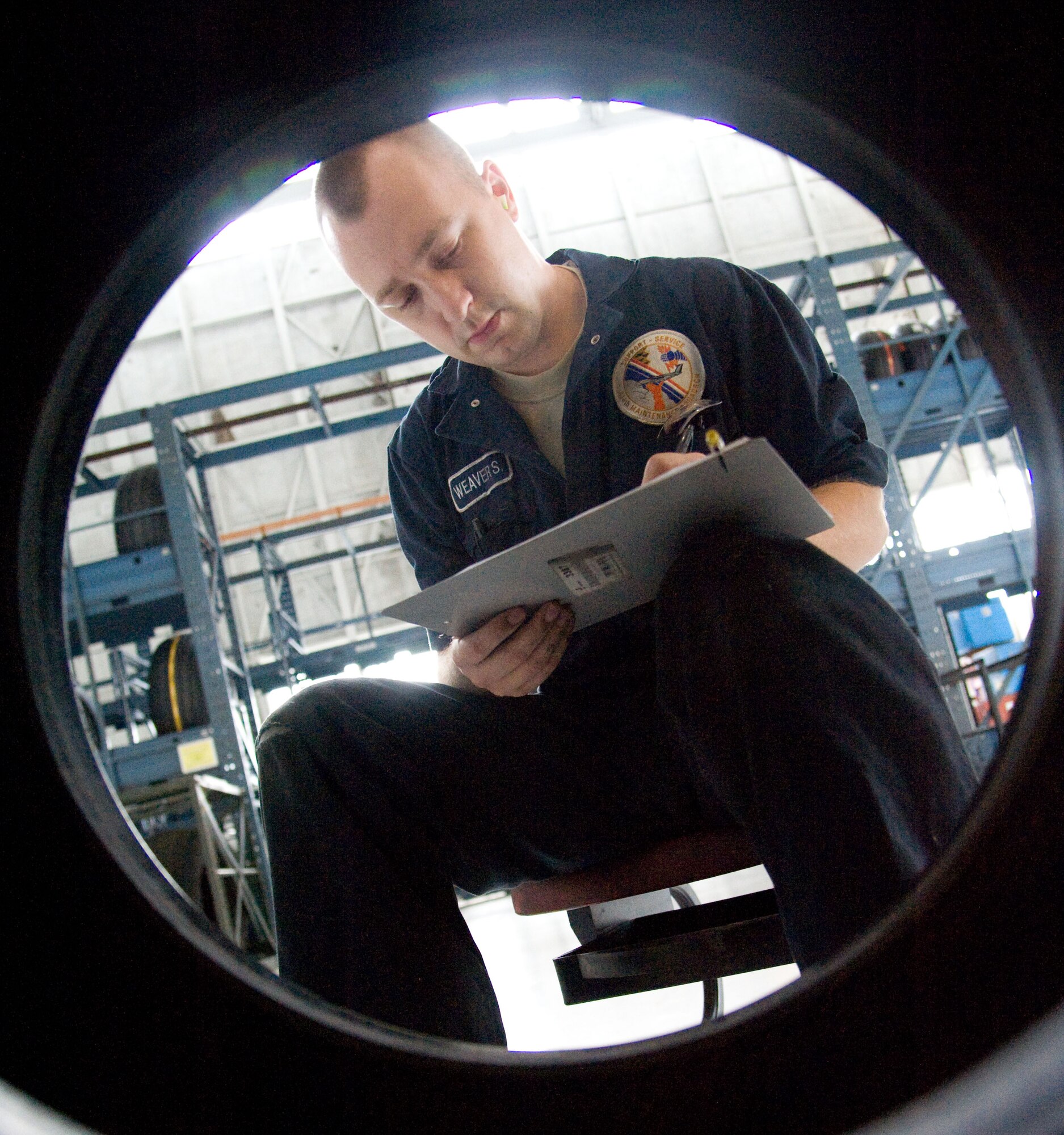 Senior Airman Samuel Weaver, a wheel and tire journeyman with the 436th Maintenance Squadron, tags a C-5M Super Galaxy nose tire for serviceability July 9, 2012, at Dover Air Force Base, Del. The inspection rotation on all tires recently dropped 60 days, increasing the workload for the wheel and tire section. (U.S. Air Force photo by Adrian R. Rowan)